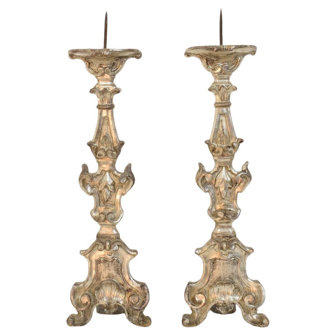Couple of 18th Century Italian Baroque Carved Wooden And Silvered Candlesticks For Sale