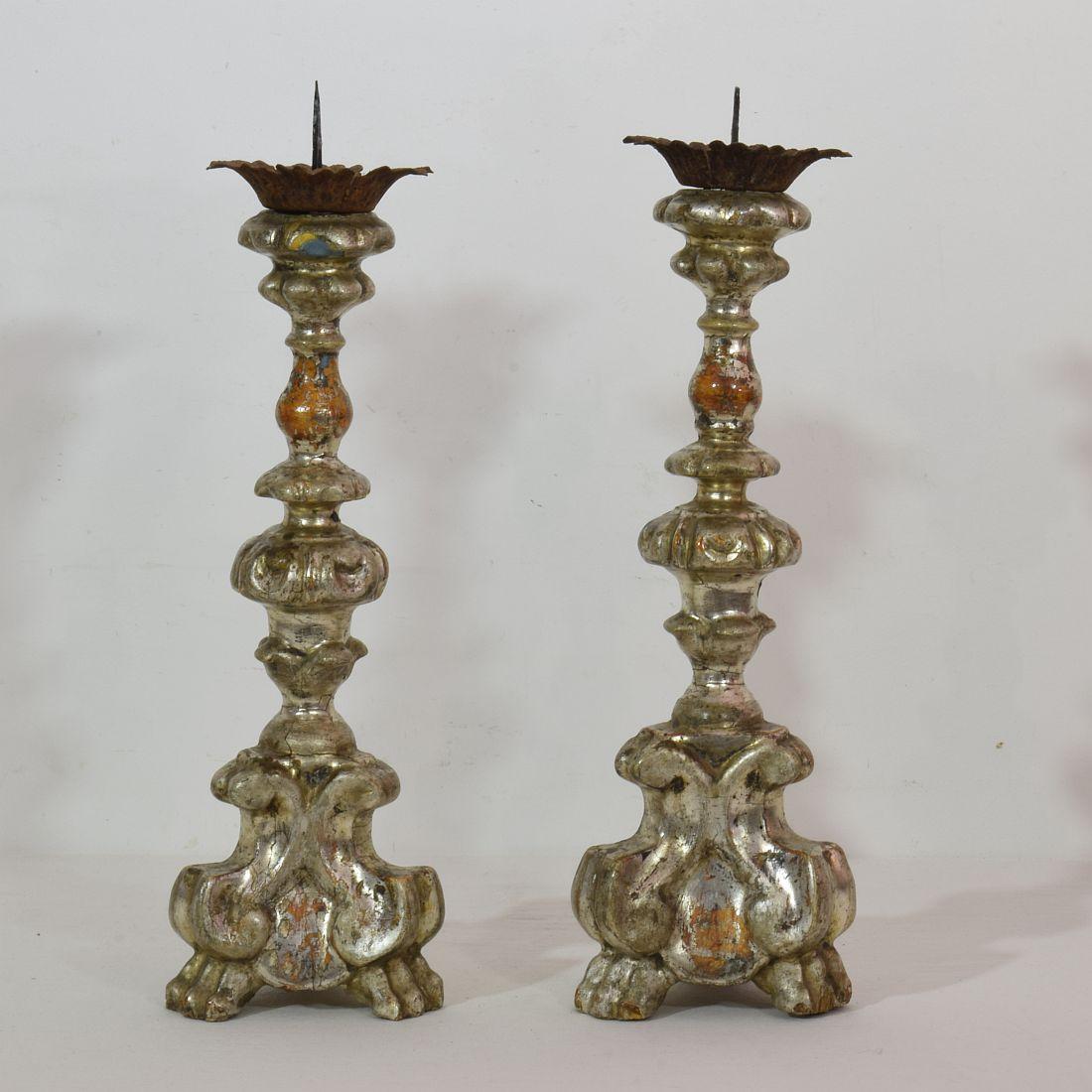 Great pair of wooden candleholders with silver leaf and traces of blue color underneath,
Italy, circa 1750-1800.
Weathered and small losses.