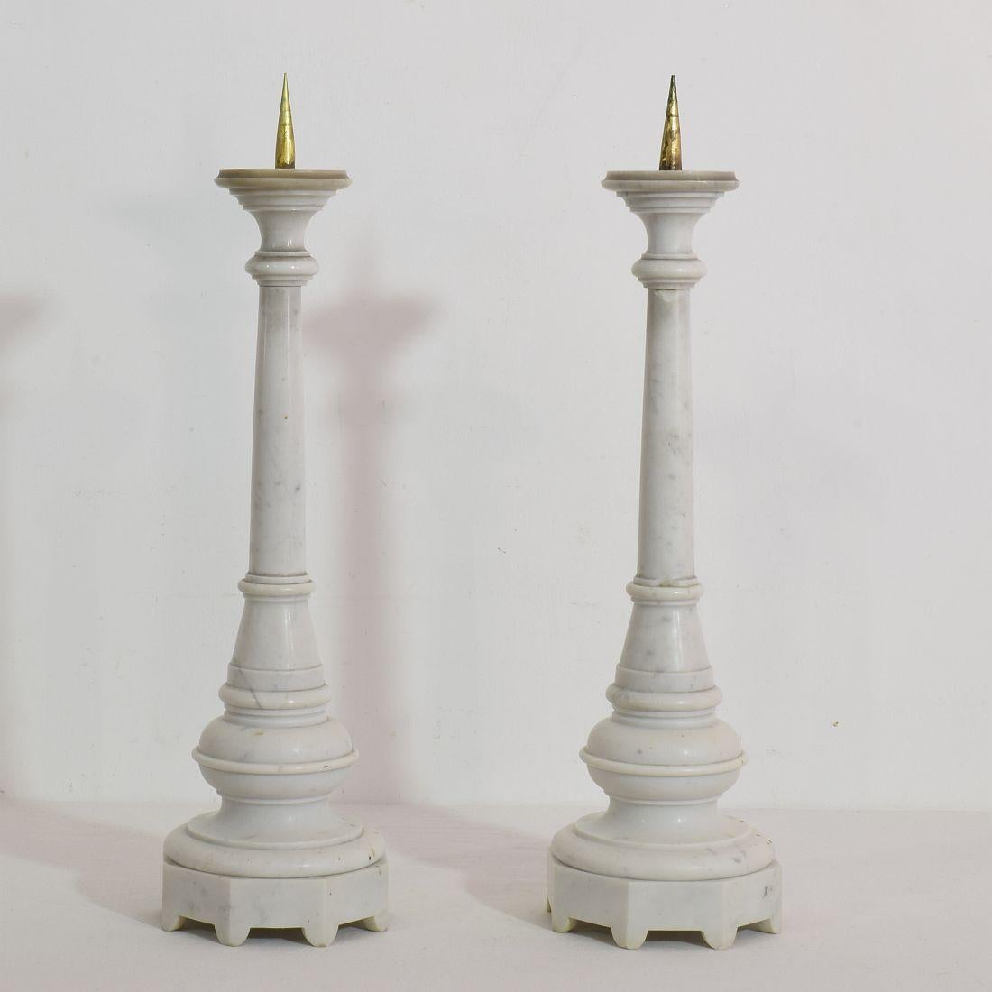Great and rare pair of marble candleholders with fire gilt bronze peaks
France, circa 1850
Weathered and small losses.