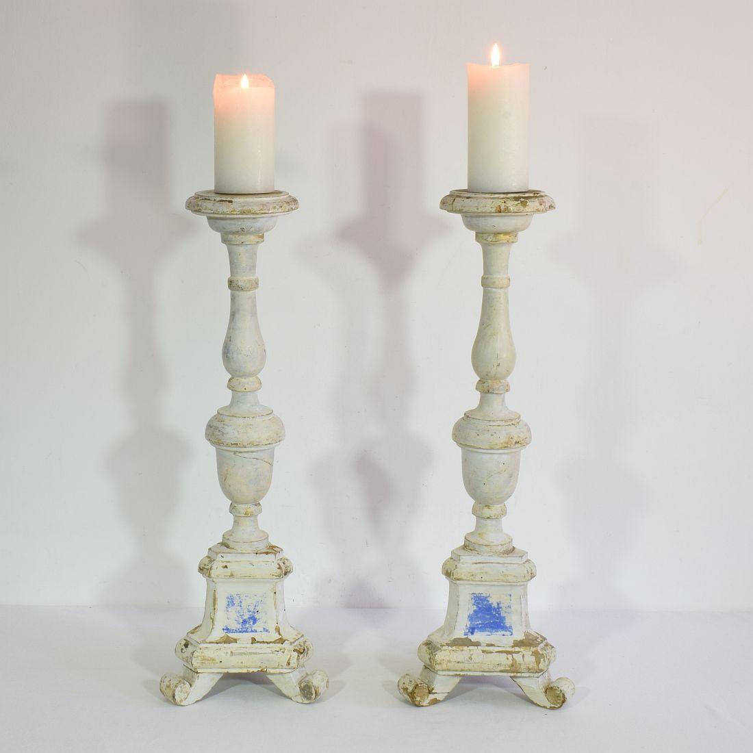 Great pair of carved wooden candleholders in neoclassical style with traces of old color
Italy, circa 1850
Weathered, small losses and old repairs.
Measurements are individual.