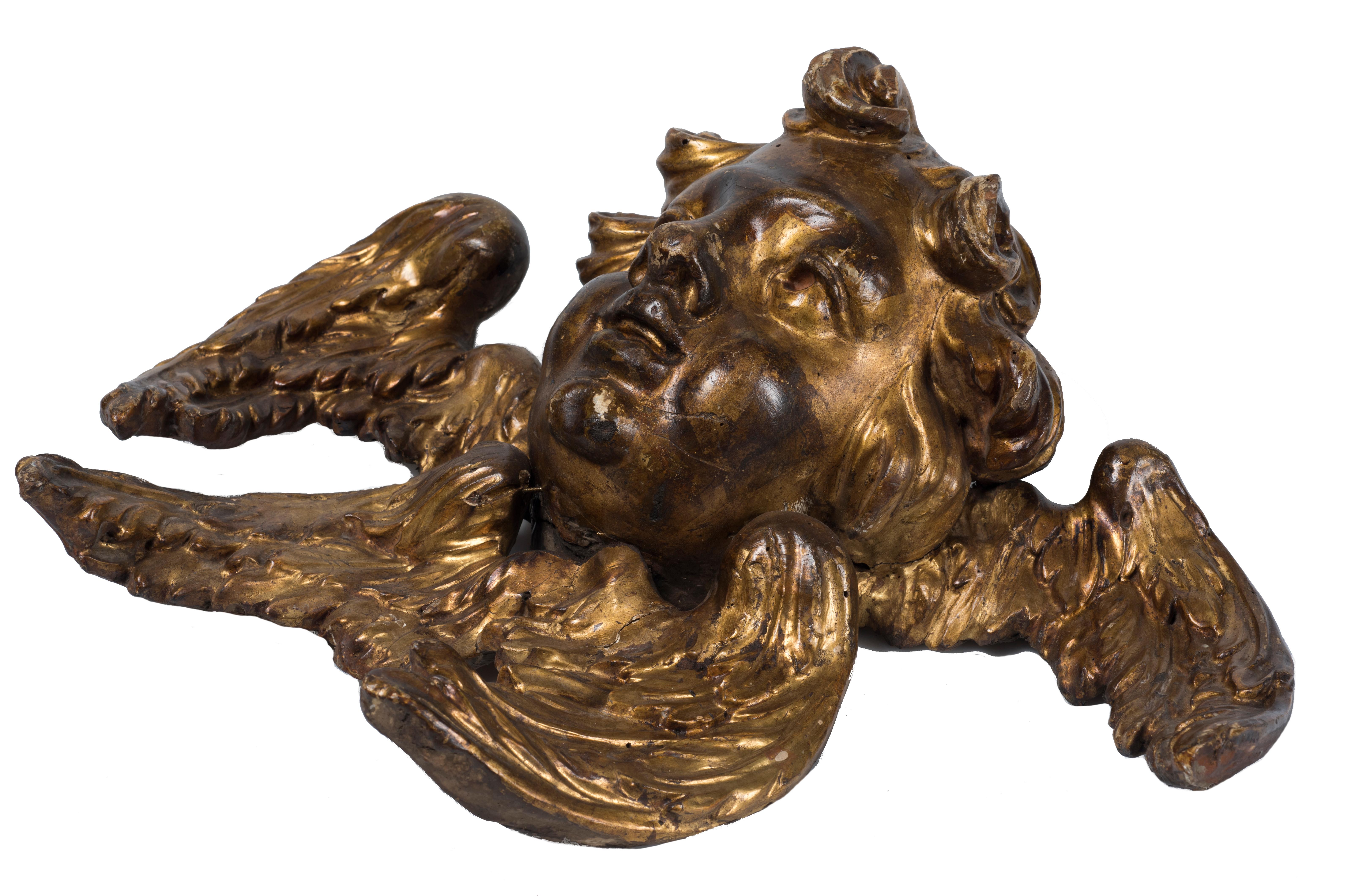 Pair of angel heads is an original decorative object realized by an anonymous artist during the XVIII century.

The little angels are made of carved and gilded wood. Good conditions, except for the loss of gilding and a small crack-up on the left