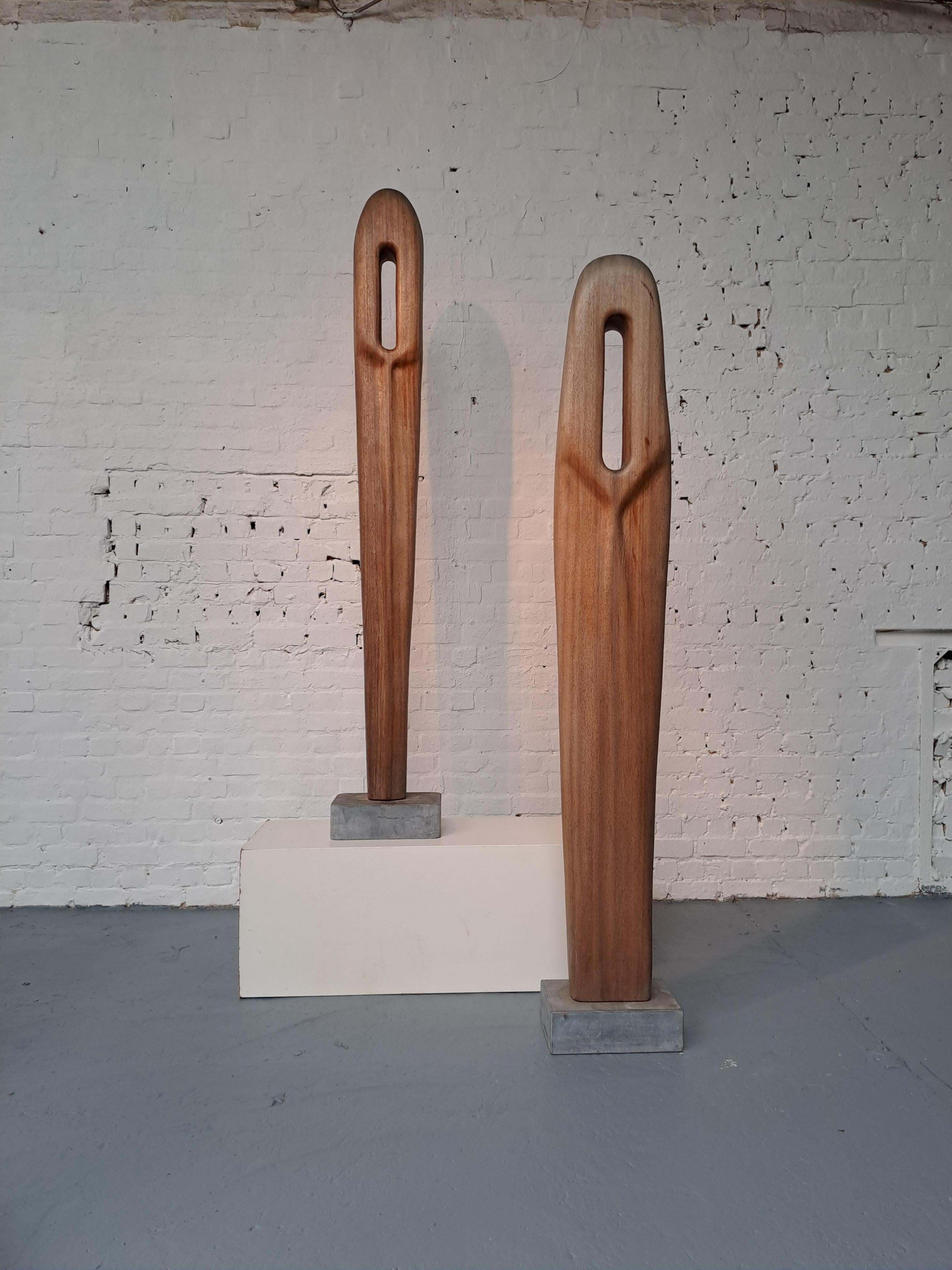 Couple of anthropomorphic sculptures in Afzelia wood by Begga D’Haese (1934 – 2023). Younger sister of Reinhoud D'Haese who was part of the nursery of the Cobra group in the 1950s and Roel D'Haese who is considered the greatest Flemish surrealist