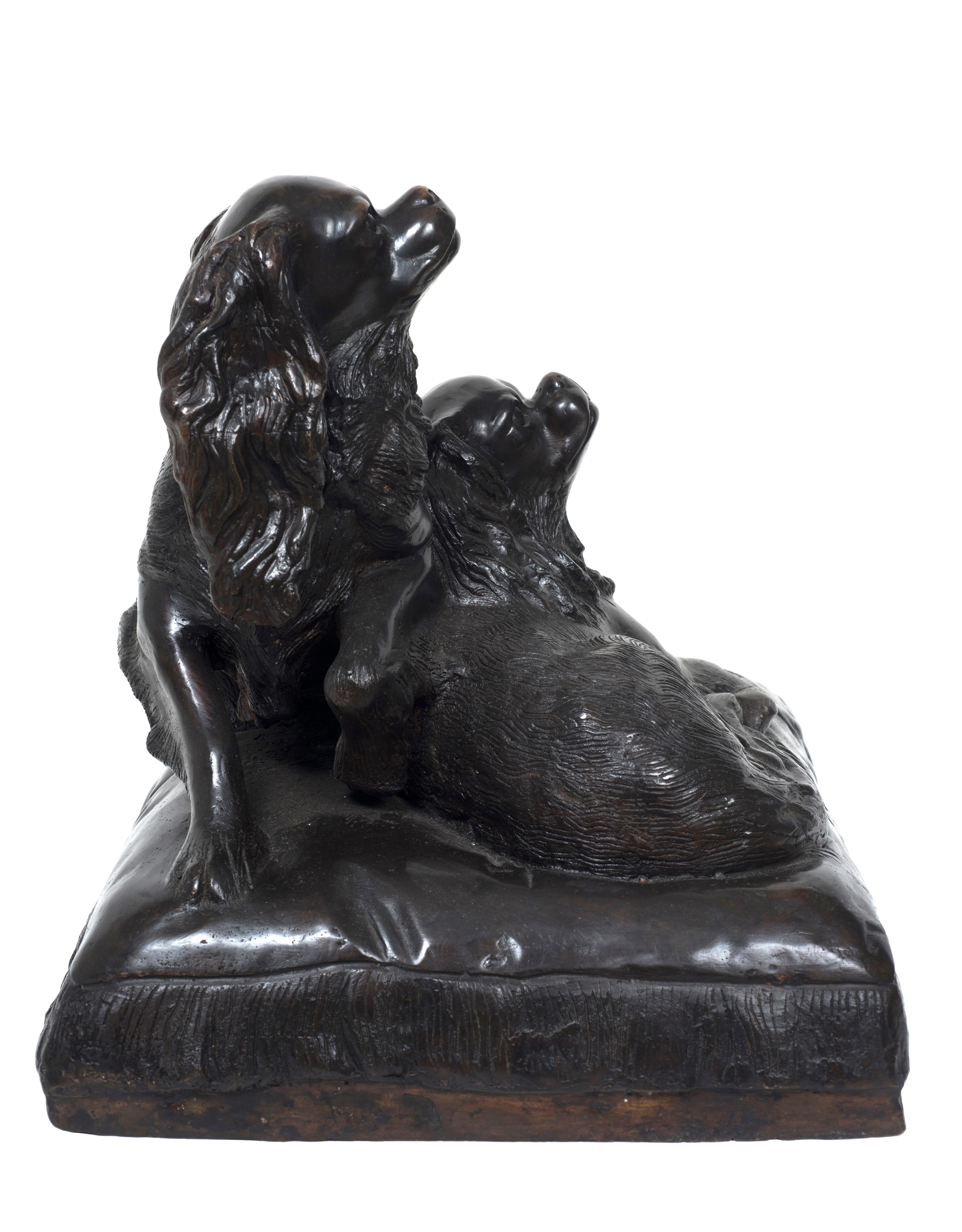 Bronze sculpture representing a pair of Cavalier King Charles Spaniel dogs on a pillow, by French Sculptor Charles Valton (Pau 1851-Paris 1918).
Group in bronze lost wax casting, excellent conditions.
Signed on pillow: C. Valton.

This artwork is