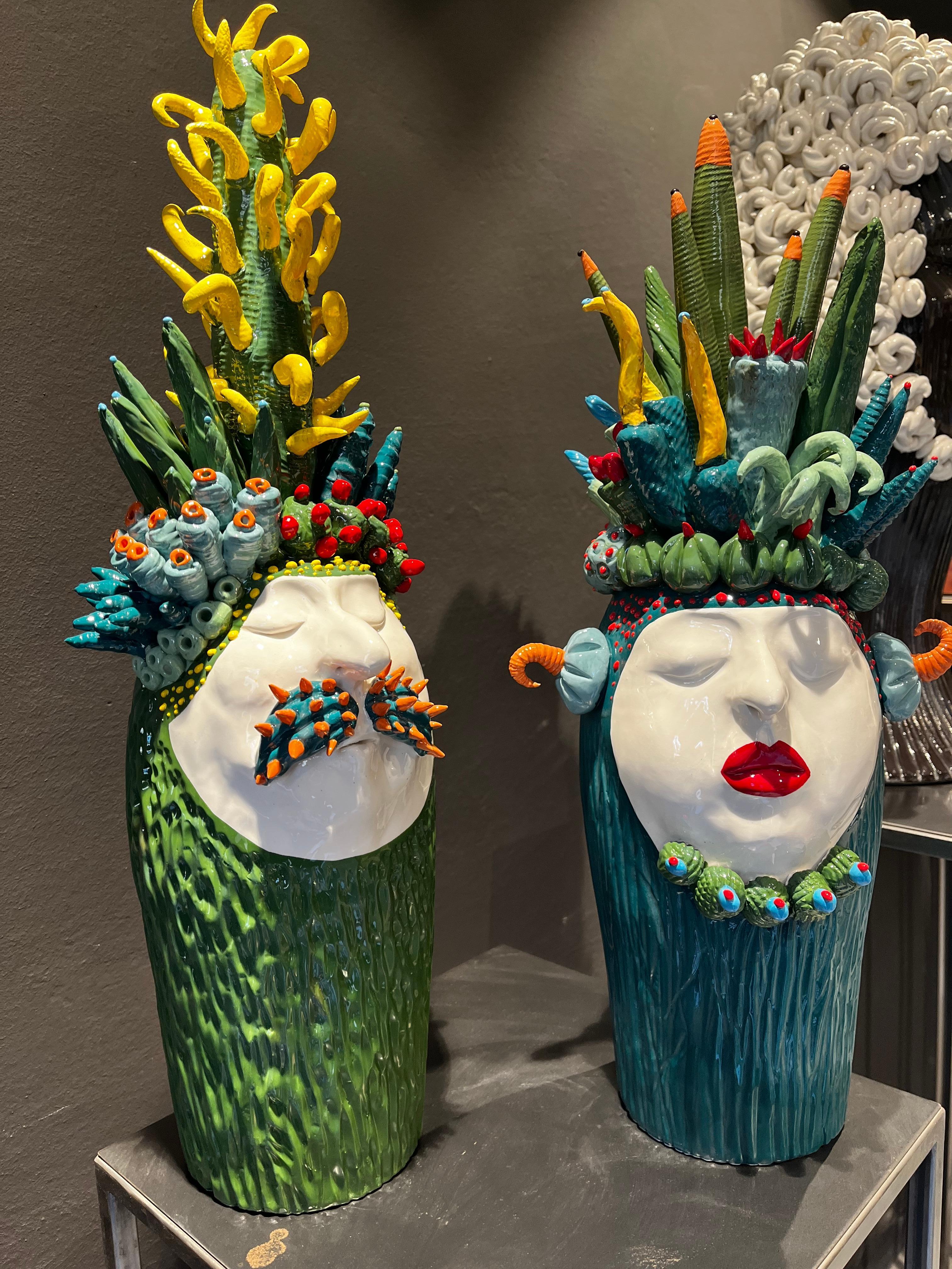 The pieces are a unique representation created by our designer. The two heads represents a man and a woman with naturalistic character, in a satirical way.
The creations are completely made by hand.
Ceramic and paint are water resistant.
 