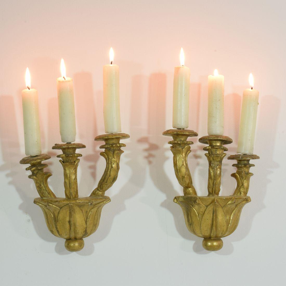 Beautiful pair of Baroque giltwood candleholders, easy to mount at your wall due to attachment of later date.
Unique and original period pieces, Italy, circa 1750.
Weathered, small losses and old repairs
Measures: H 27 cm (10.75 in), W 20 cm (8