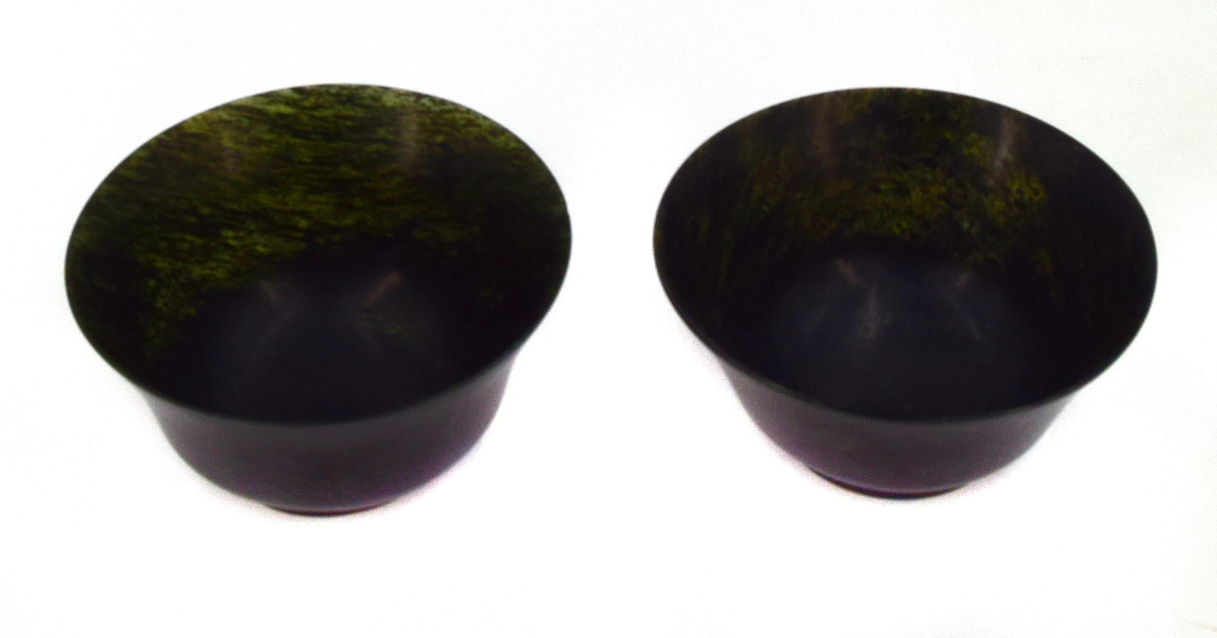 Pair of green jade Chinese bowls. 

This artwork is shipped from Italy. Under existing legislation, any artwork in Italy created over 70 years ago by an artist who has died requires a licence for export regardless of the work’s market price.
 