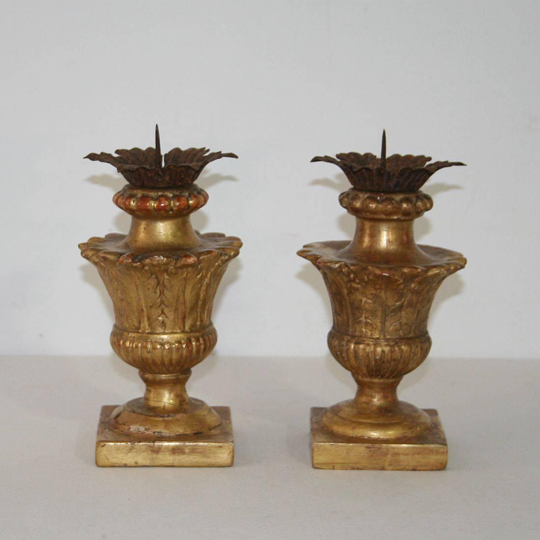 Great pair of small neoclassical candlesticks with their original gilding, Italy, circa 1780-1800. Weathered, small losses and old repairs.