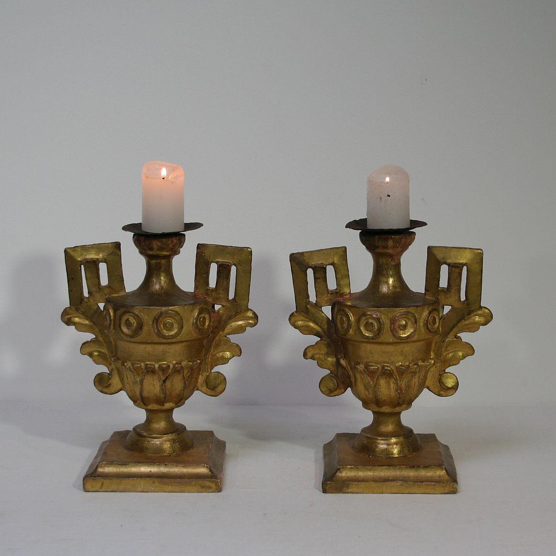 Unique pair of small neoclassical candlesticks with their original gilding, Italy, circa 1780-1800.
Weathered, small losses and old repairs.