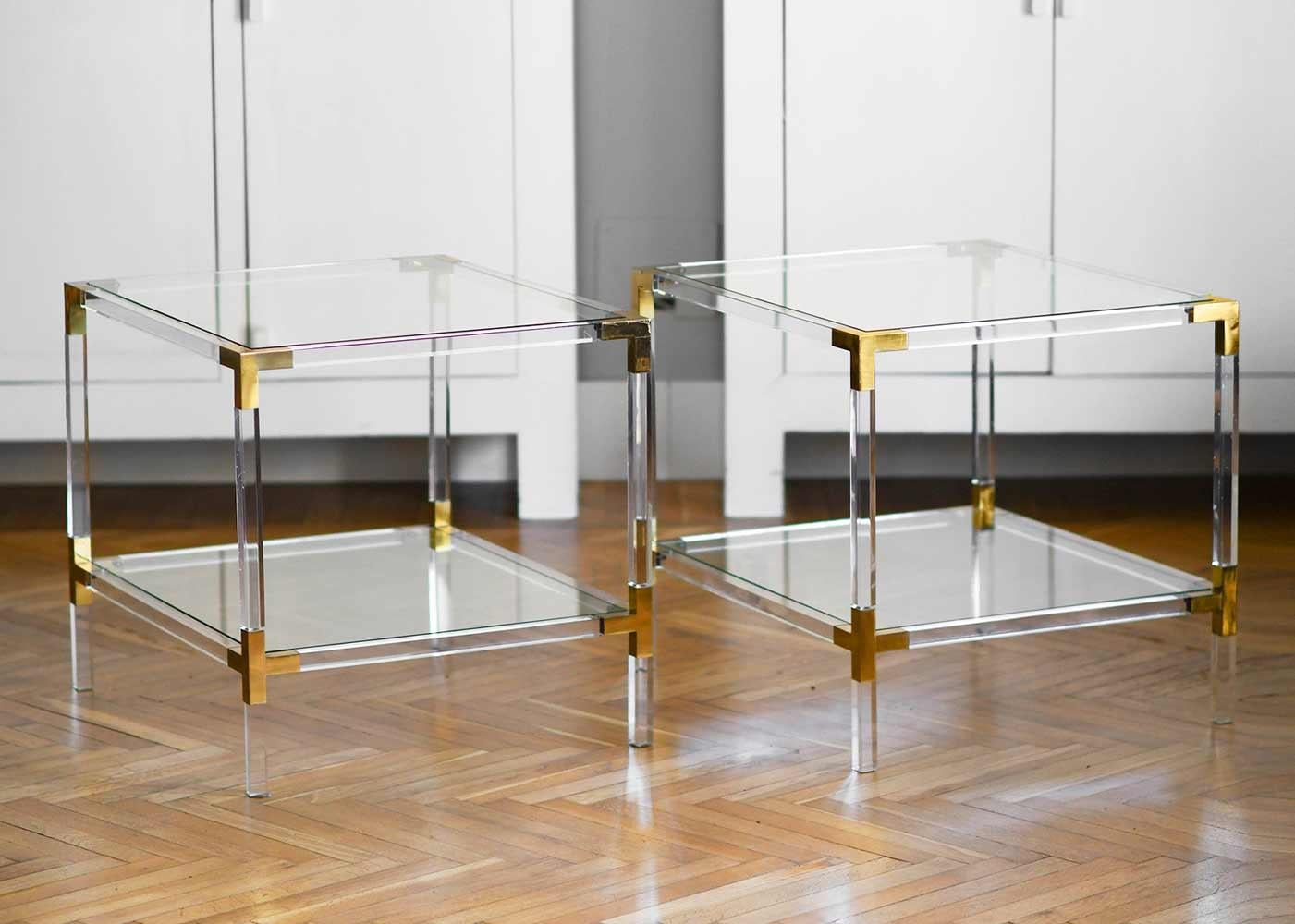 Couple of plexi coffee tables with brass details and crystal top, 1980.