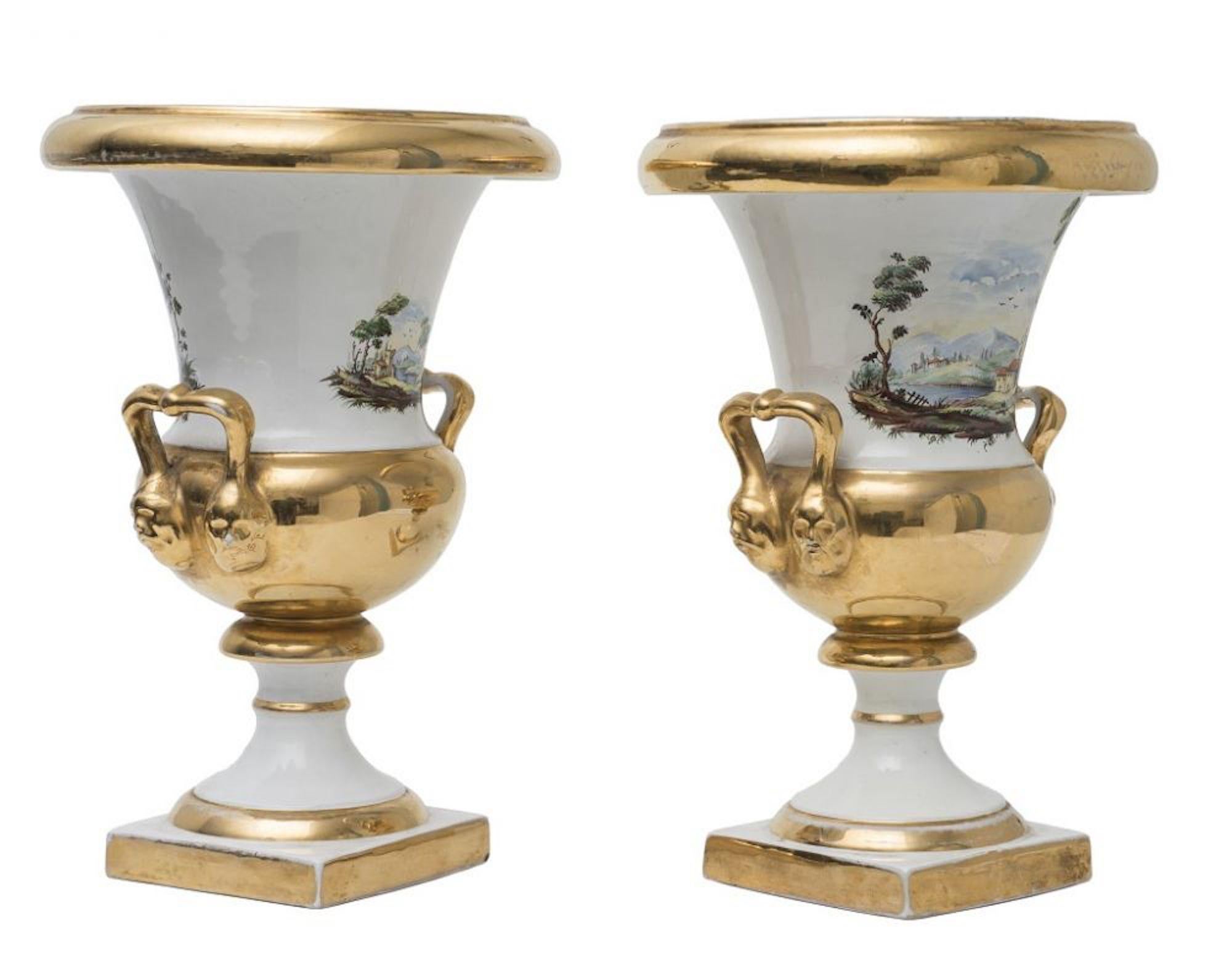 This pairof porcelain vases is a beautiful original decorative object realized by an Italian manufacturer in the 19th century. Medicean style.

Beautiful painted country scenes appear on the necks of the vases. 

Good conditions.

This artwork is