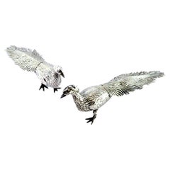 Couple of silver peacocks with reliefs and applications