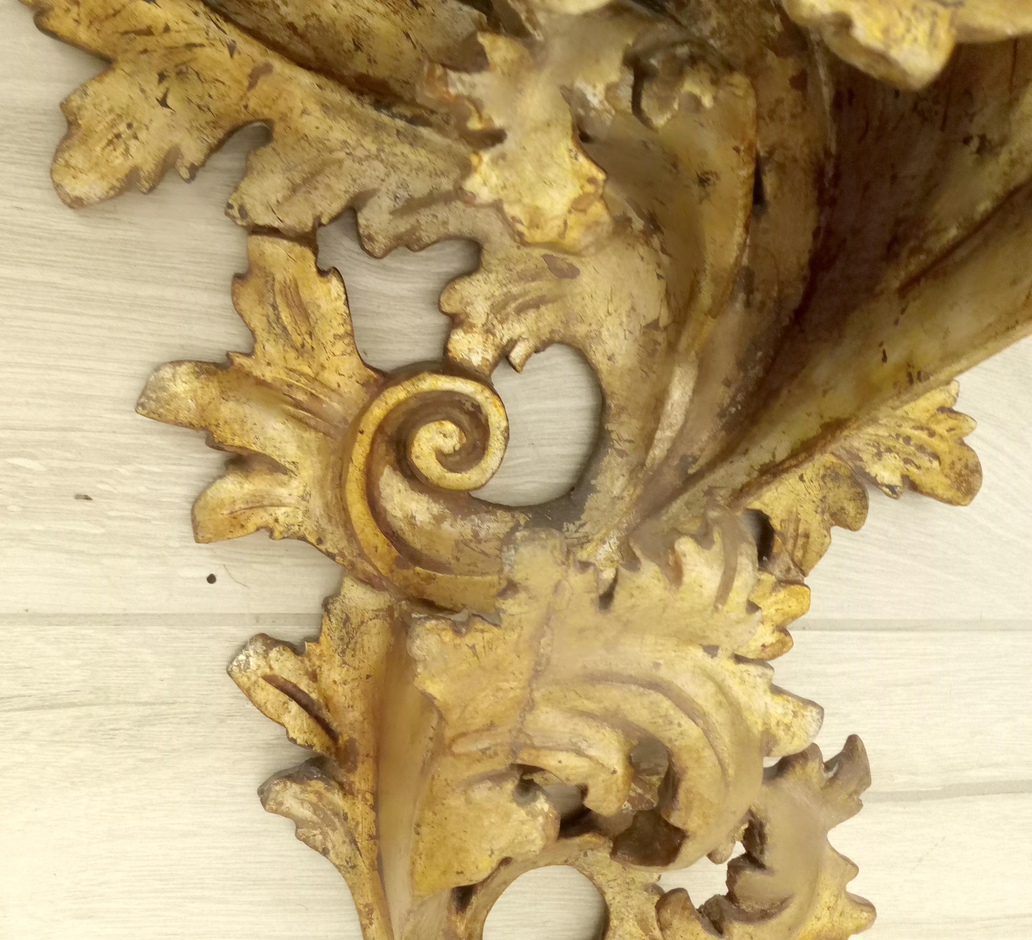 Highly decorative silver wooden hand-carved wall shelves. Design of acanthus leaves.