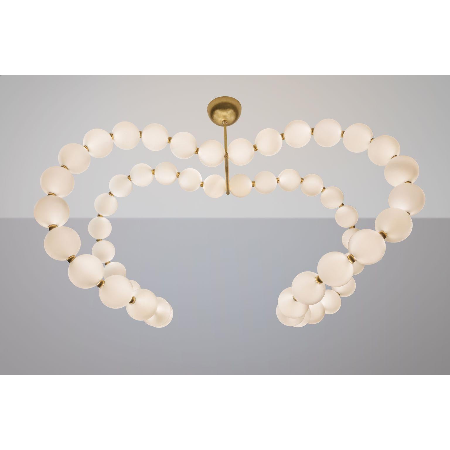 Courbes de Perles Chandelier by Ludovic Clément D’armont
Dimensions: D 115 x W 70 x H 92 cm
Materials: Blown glass, brass, LEDs

All our lamps can be wired according to each country. If sold to the USA it will be wired for the USA for