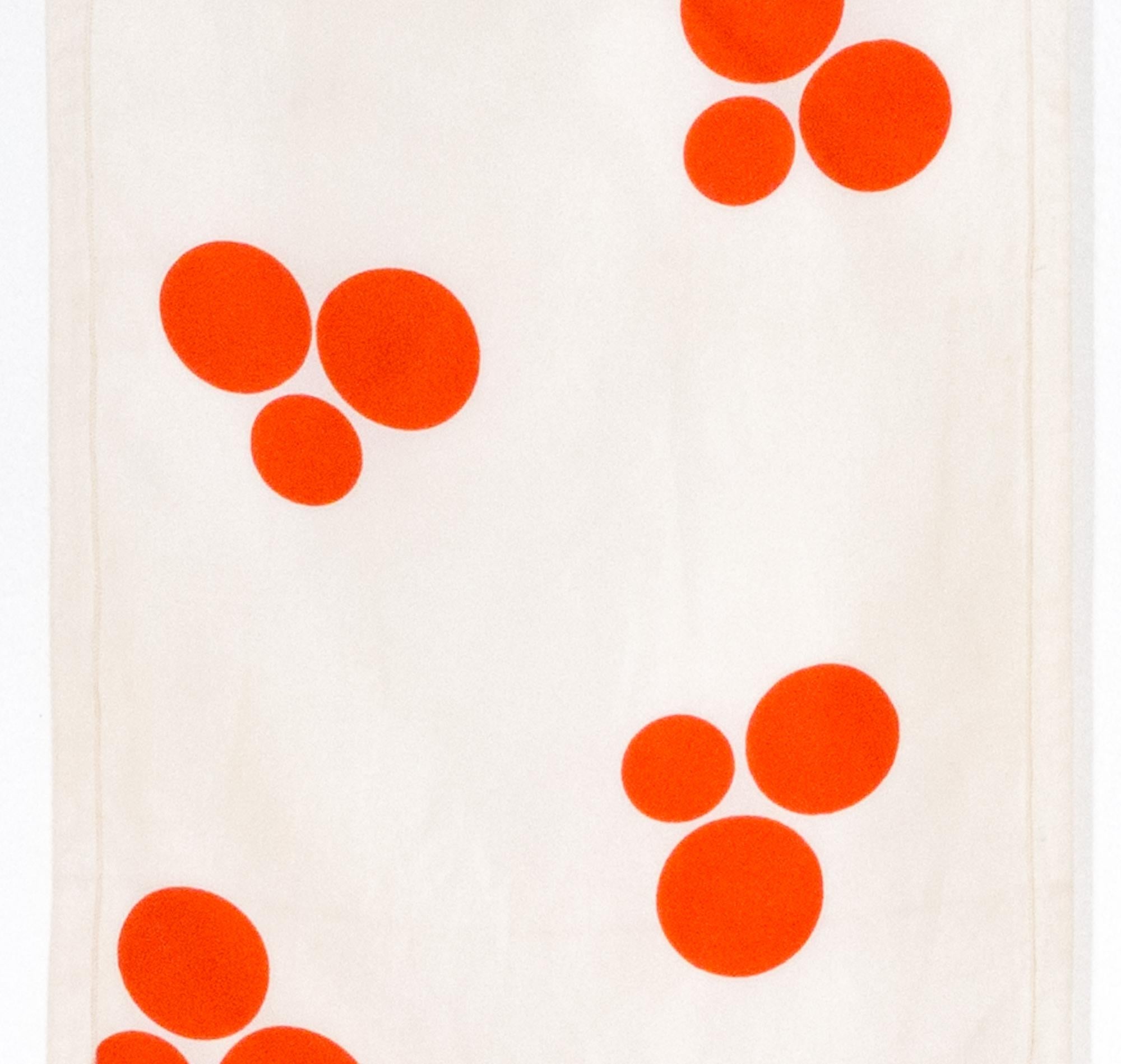 1970 Courreges ivory silk scarf featuring red dots print and a logo print signature. 
In good vintage condition( some spots on the ground). Made in France.
9.4in (24cm)  X 34.6in. (88 cm)
We guarantee you will receive this  iconic item as described