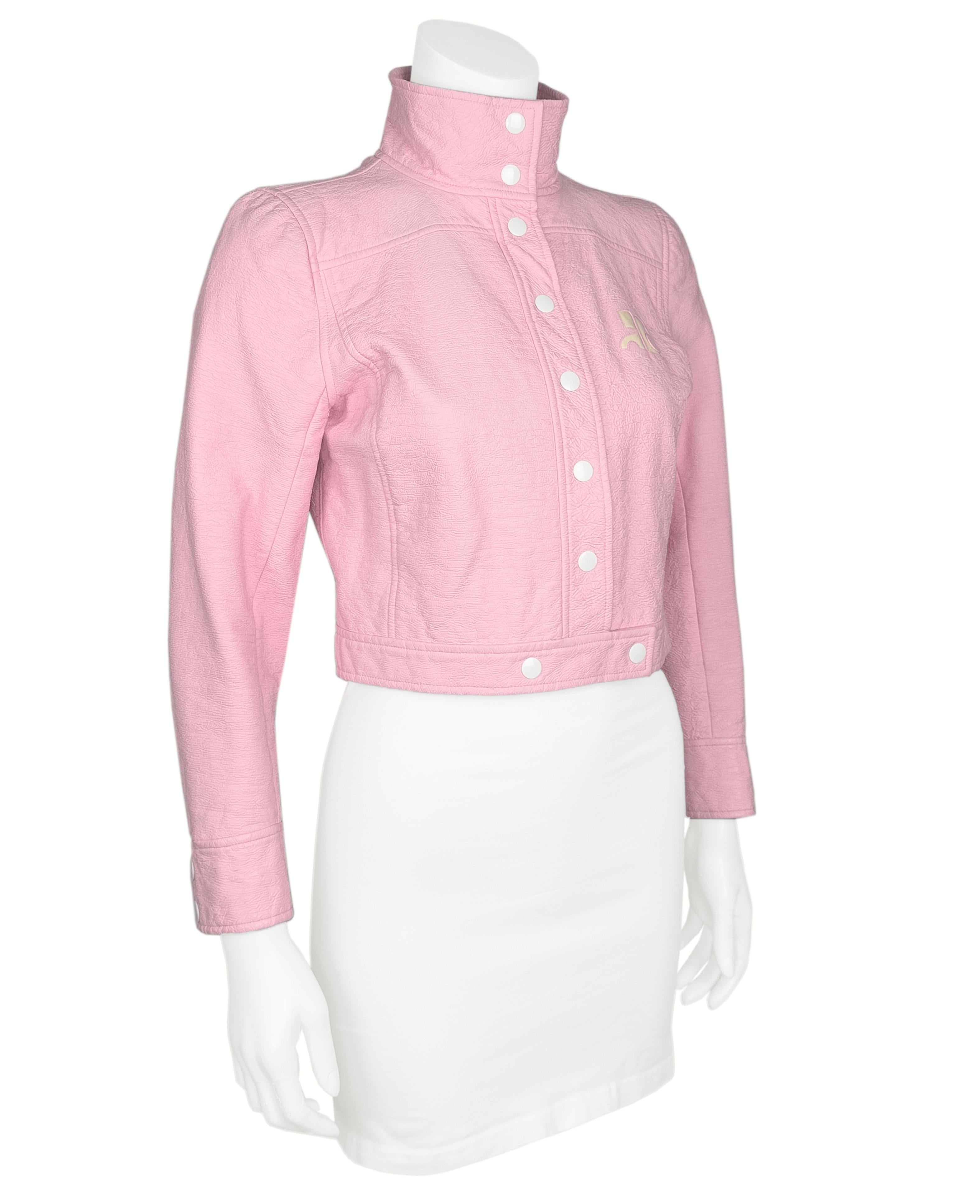 Pre-owned Courrèges baby pink vinyl leather jacket featuring a funnel neck collar, cream logo detail at chest, long sleeves with buttoned cuffs, cropped boxy fit, and snap button closure. logo lining.

signs of wear consistent with age including
