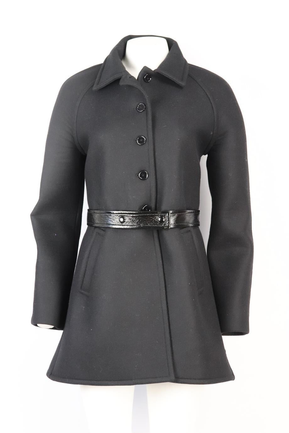 Courrēges belted leather trimmed wool blend coat. Black. Long sleeve, crewneck. Button fastening at front. 48% Wool, 20% polyester, 20% polyurethane, 12% nylon; lining: 80% wool, 20% nylon; lining2: 88% cotton, 10% polyurethane, 2% elastane. Size:
