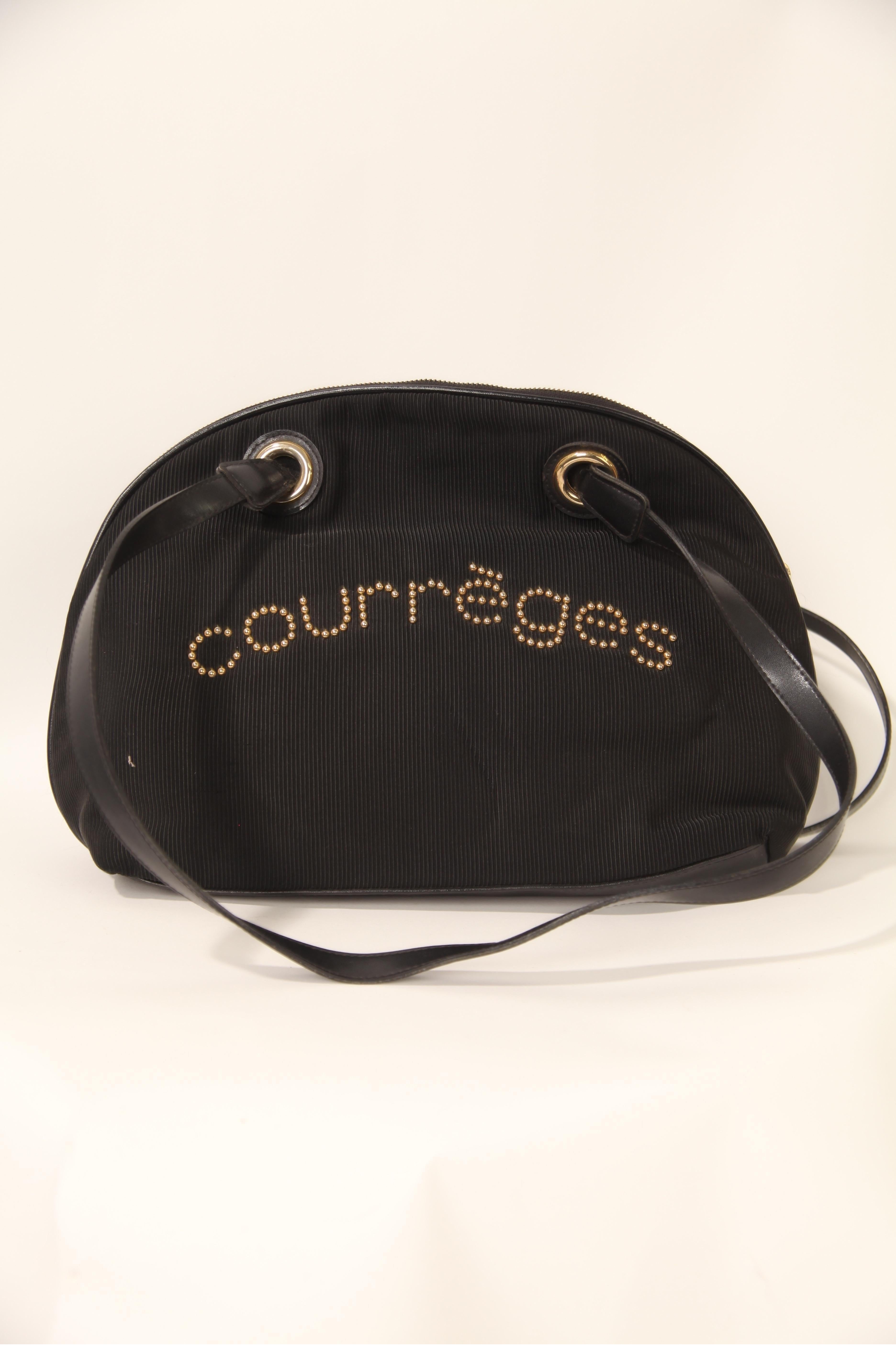 Courrèges, a French fashion house founded by André Courrèges, was known for its futuristic and avant-garde designs in the 1960s and 1970s This Demi Lune bag by Courrèges is a classic design from the fashion house. It's a semi-circular or half-moon