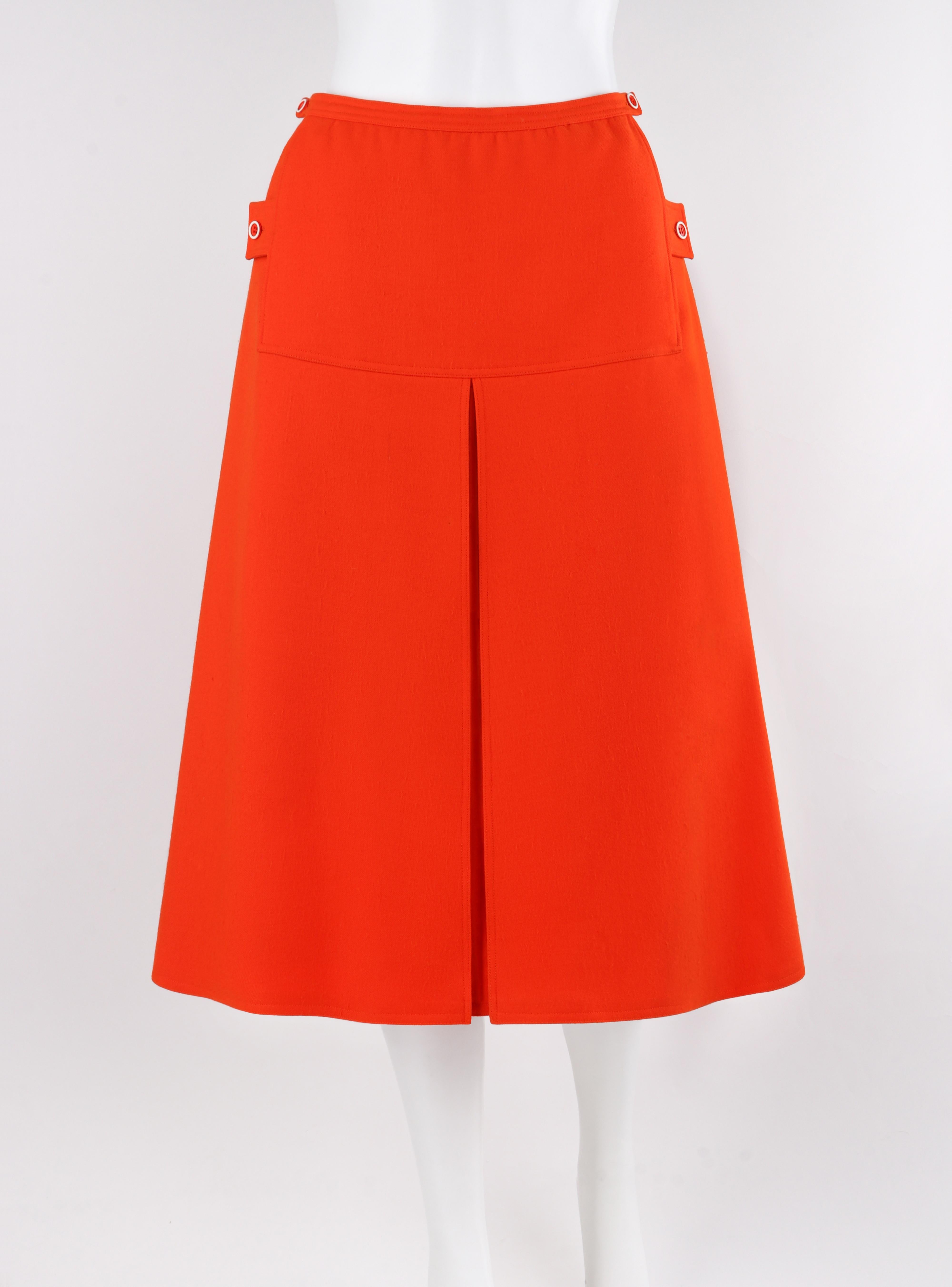 COURREGES c.1960's Vtg Orange Wool A Line Pleated Knee Length Button Skirt

Brand / Manufacturer: Courreges
Circa: 1960's
Designer: Andre Courreges
Style: A Line Skirt
Color(s): Orange, White (buttons)
Lined: Yes
Marked Fabric: 