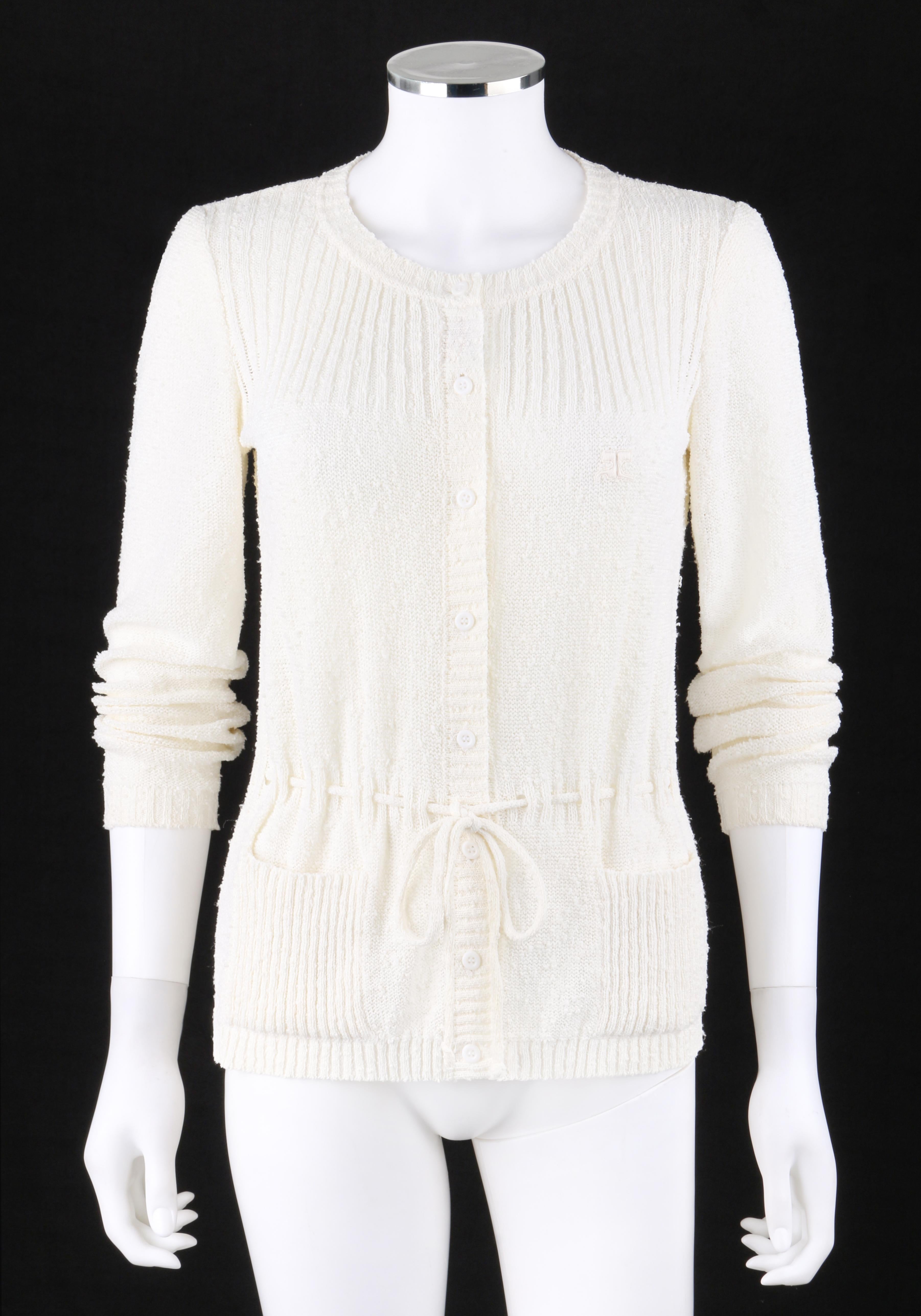 COURREGES c.1970-1980's Ivory Slub Knit Button-Up Long Sleeve Cardigan Sweater
 
Circa: c.1970's-1980's
Label(s): Courreges Paris 
Style: Cardigan sweater
Color(s): Ivory
Lined: No
Marked Fabric Content: Triacetate/polyester/polyamide
Additional