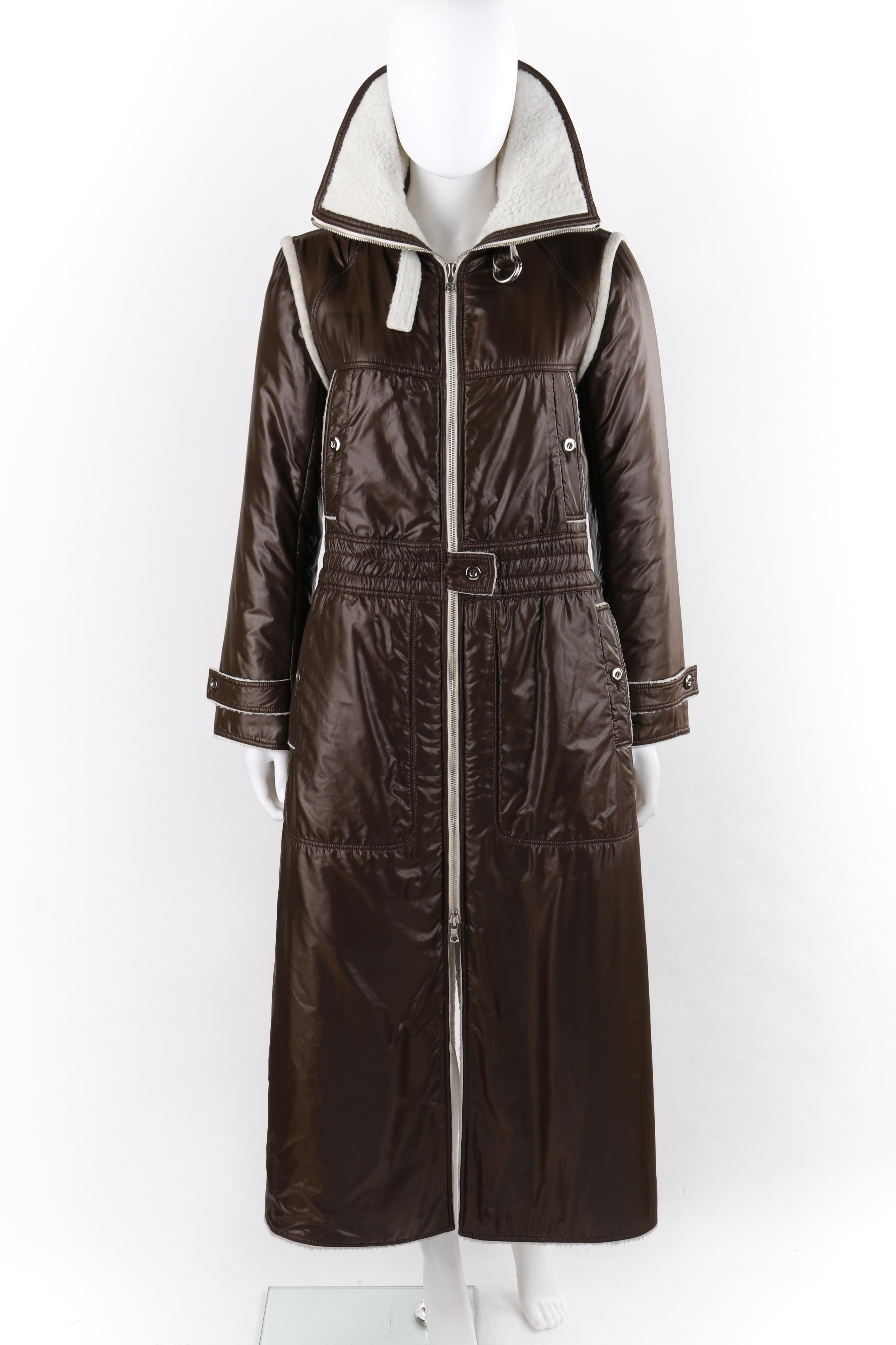COURREGES c.1970’s Brown White High Convertible Collar Full-Length Coat Jacket
Circa: 1970s
Label(s): Courreges Paris
Designer: Andre Courreges
Style: Full-length parka style coat jacket
Color(s): Shades of brown and white
Lined: Yes
Marked Fabric