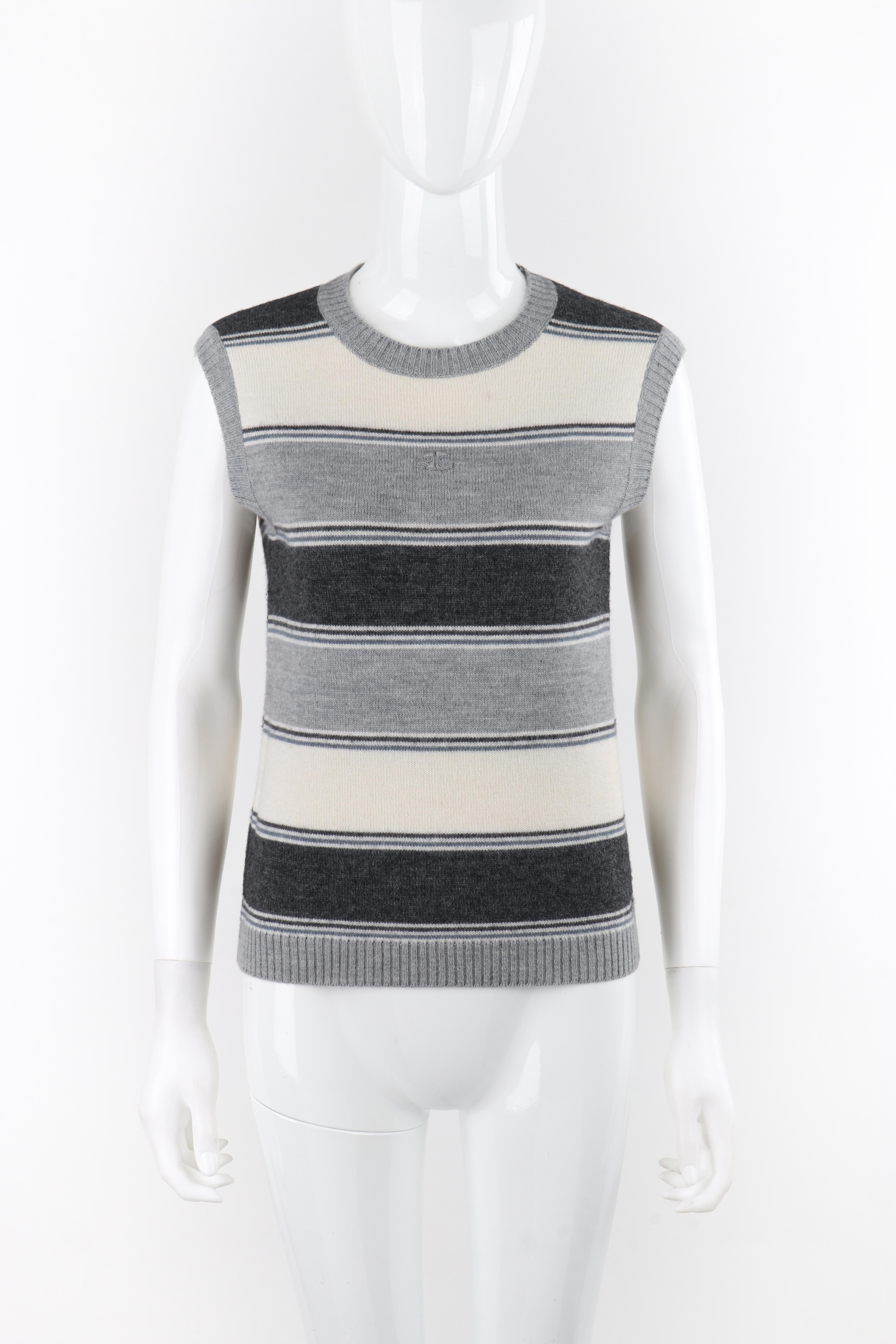Brand / Manufacturer: Courreges
Circa: 1970s
Designer: Andre Courreges
Style: Sleeveless Sweater Top
Color(s): Shades of Gray, blue, white
Lined: No
Marked Fabric Content: 