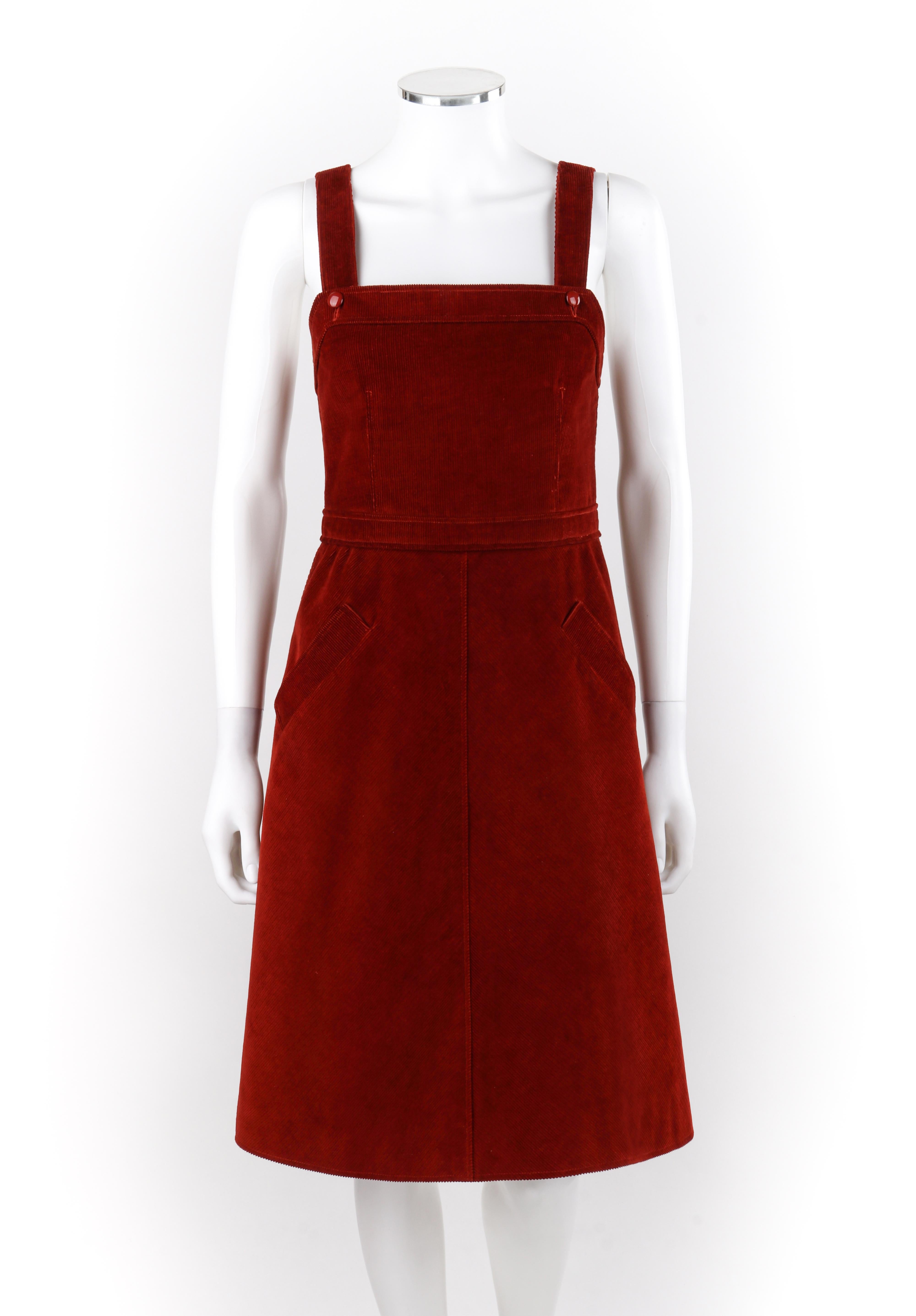 COURREGES c.1970's Hyperbole Blood Red Corduroy Sleeveless A-Line Jumper Dress
Circa: 1970s
Label(s): Courreges Hyperbole
Designer: Andre Courreges
Style: Jumper dress
Color(s): Red
Lined: Yes
Marked Fabric Content: Shell: “100% Cotton”; Lining: