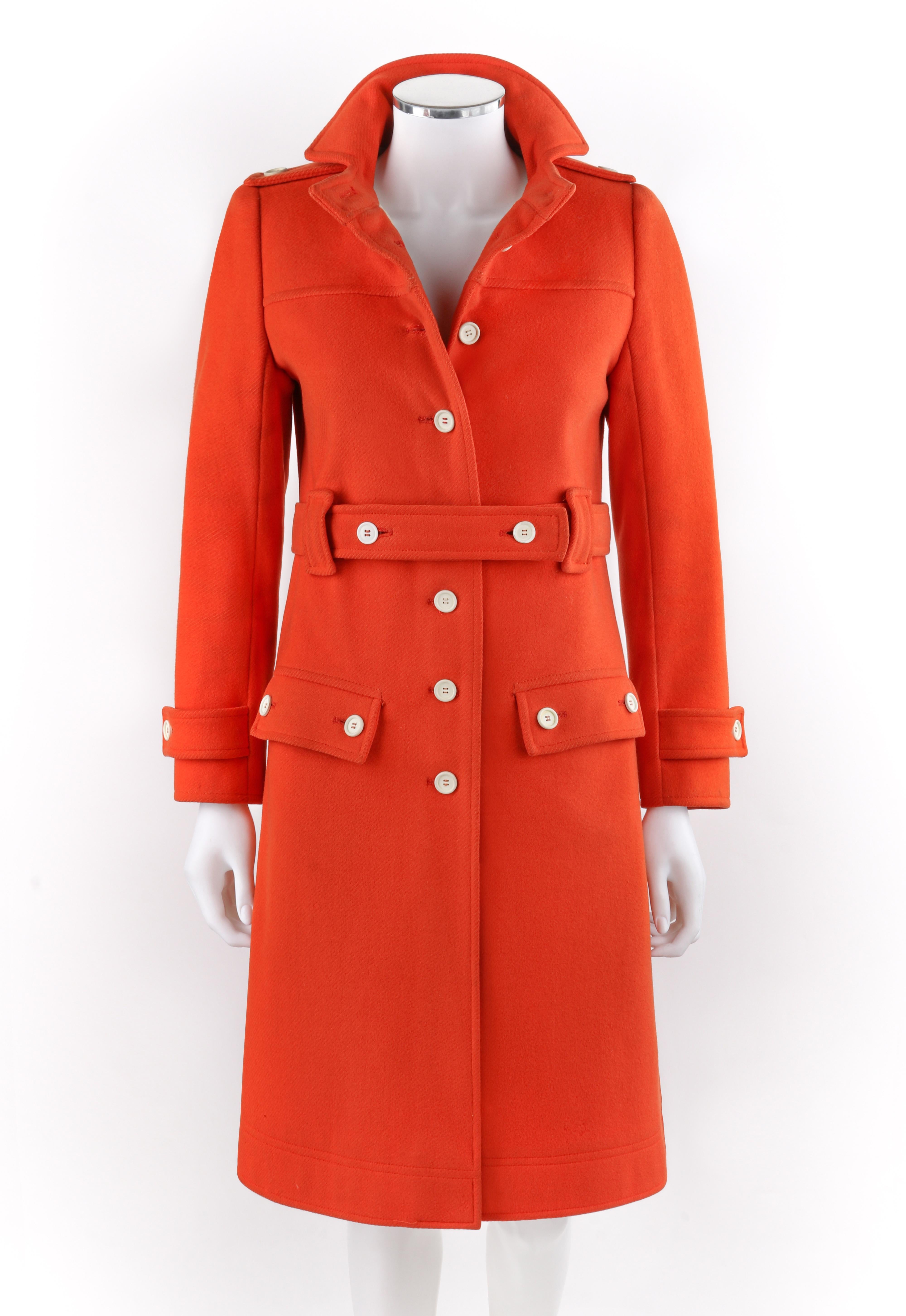 COURREGES c.1970’s Hyperbole Orange Belted Button Up Detail Overcoat Numbered

Circa: 1970’s
Label(s): Courreges ‘Hyperbole’ -numbered
Designer: Andre Courreges
Style: Belted Overcoat
Color(s): Orange (exterior); off white (lining)
Lined: