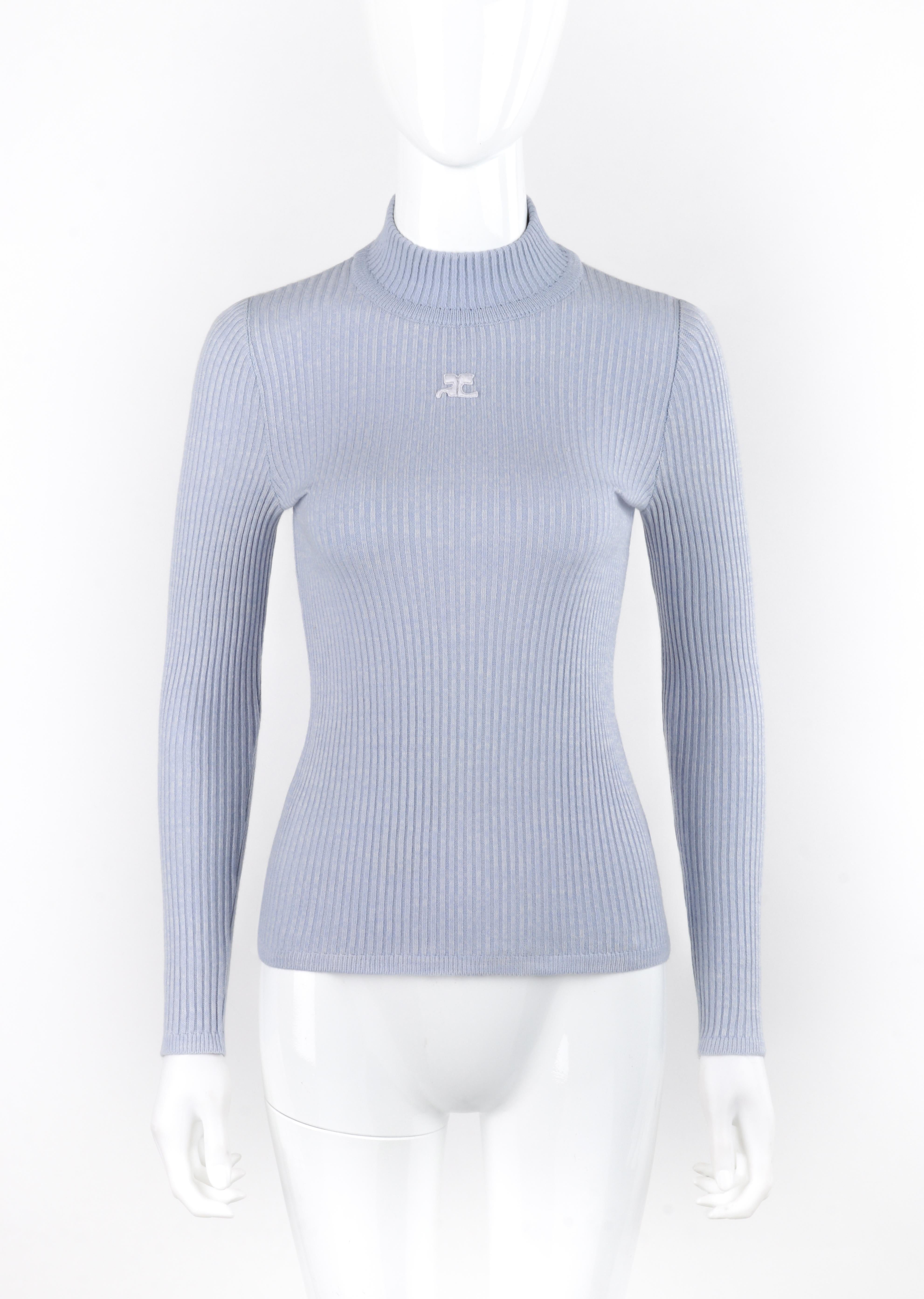 Brand / Manufacturer: Courreges
Circa: 1970s 
Designer: Andre Courreges
Style: Long Sleeve Sweater
Color(s): Shades of blue
Lined: No
Unmarked Fabric Content (feel of): Cotton knit
Additional Details / Inclusions: Courreges circa 1970s long sleeve