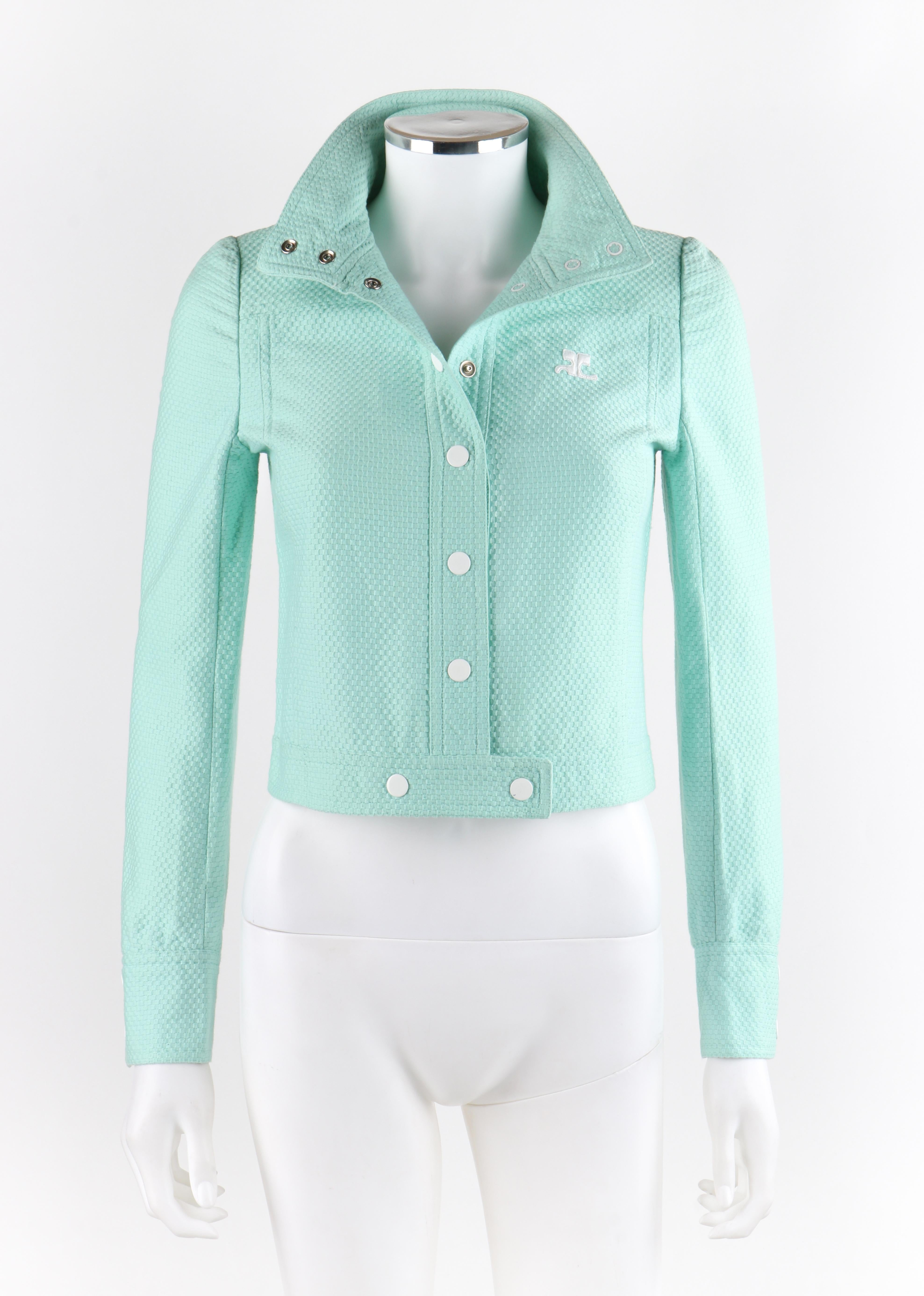 COURREGES c.1970’s Mint Blue Embroidered Signature Logo Mod Cropped Jacket
 
Circa: 1970’s
Label(s): Courreges Paris
Designer: Andre Courreges
Style: Cropped jacket
Color(s): Mint blue
Lined: No
Marked Fabric Content: “100% Cotton”
Unmarked Fabric