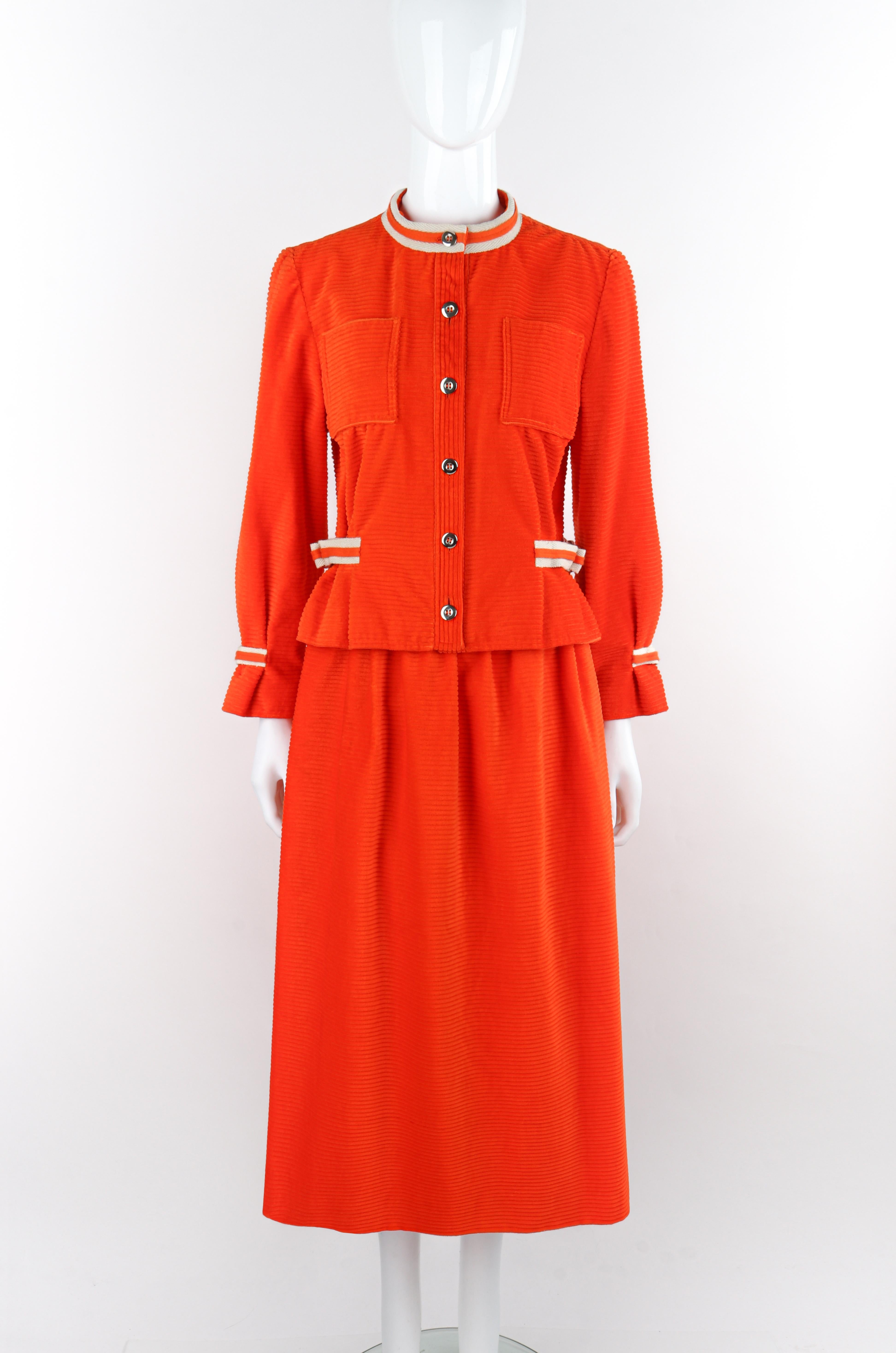 COURREGES c. 1970's Orange Corduroy Button Up Jacket Blazer Skirt Suit Set VTG

Brand / Manufacturer: Courreges
Circa: 1970s
Designer: Andre Courreges
Style: Jacket Skirt Suit Set
Color(s): Orange, White (detailing), Silver (buttons)
Lined: