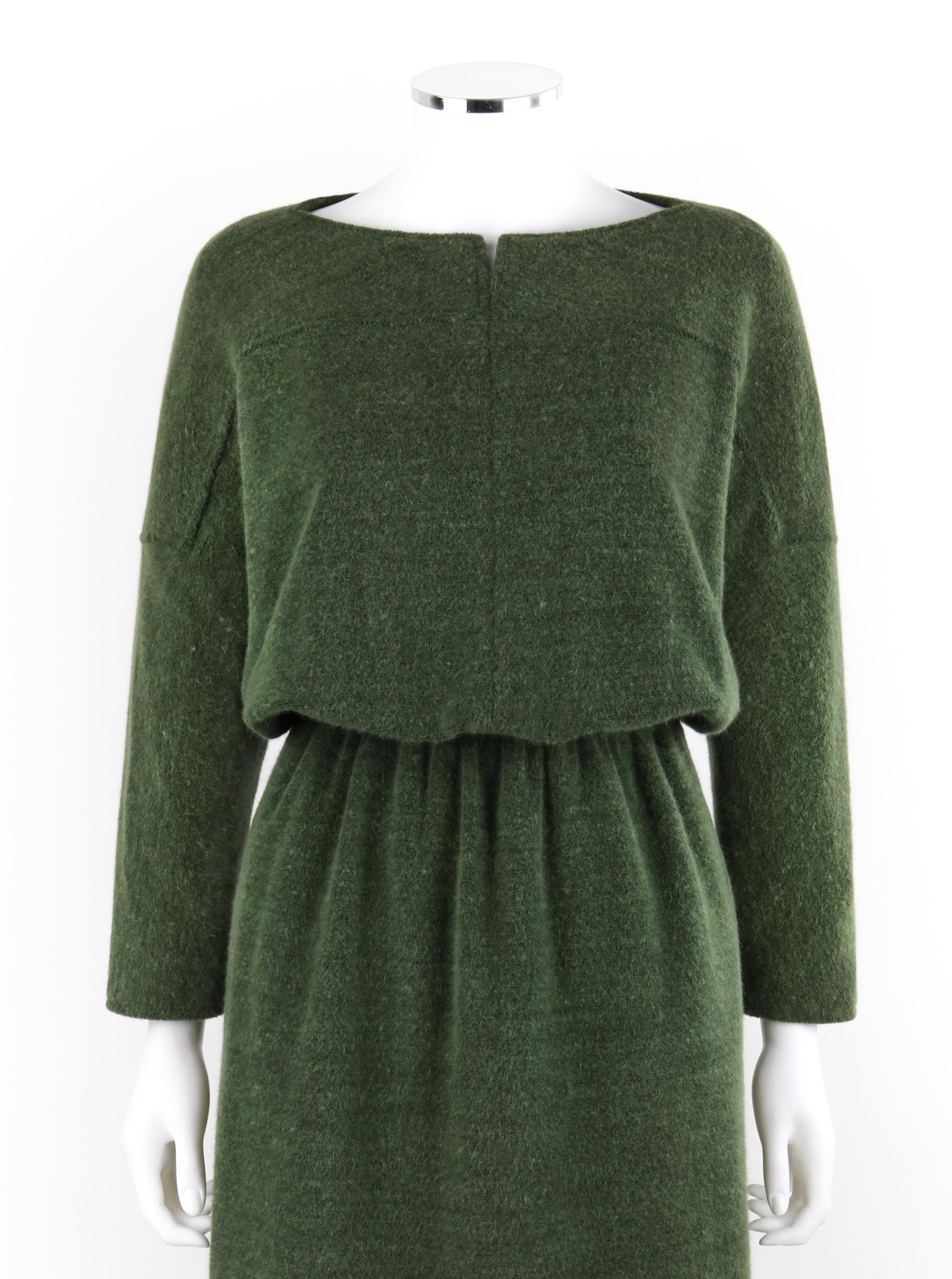 COURREGES c.1980’s Forest Green Knit Long Sleeve Cinched Waist Midi Tunic Dress
Circa: 1980’s
Label(s): Courreges Paris
Designer: Andre Courreges
Style: Midi knit tunic dress
Color(s): Forest green
Lined: Yes
Marked Fabric Content: “42% Wool, 41%