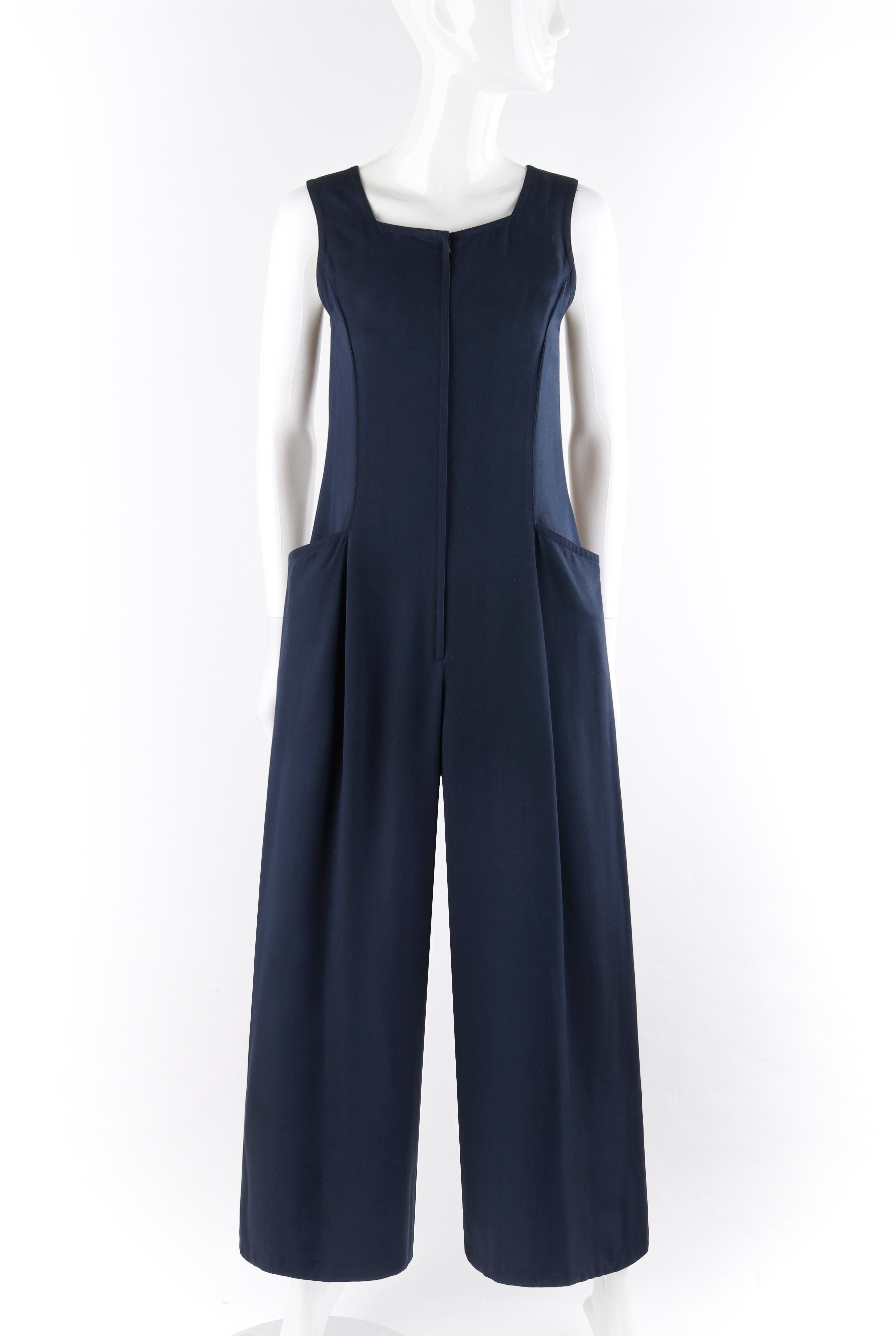 COURREGES c.1980’s Navy Blue Zip Front Wide Leg Sleeveless Jumpsuit
Circa: 1980’s
Label(s): Courreges Paris
Designer: Andre Courreges
Style: Jumpsuit
Color(s): Navy blue
Lined: No
Marked Fabric Content: “80% Viscose, 20% silk”
Unmarked Fabric