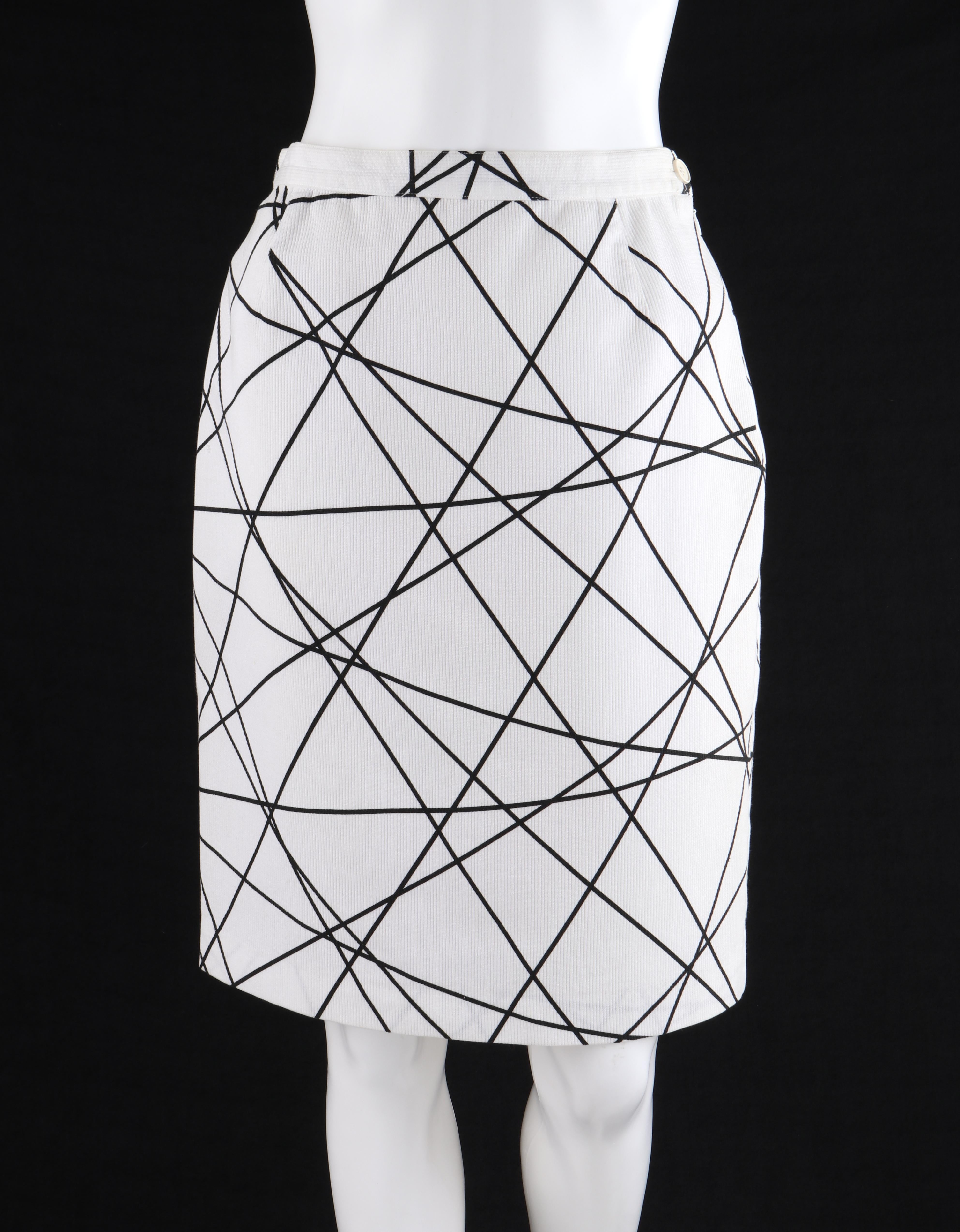 COURREGES c.1980’s White Black Geometric Abstract Print Ribbed Sheath Skirt
 
Circa: 1980’s
Label(s): Courreges Paris
Designer: Andre Courreges
Style: Sheath skirt 
Color(s): Black and white
Lined: No
Marked Fabric Content: “80% Cotton, 20%
