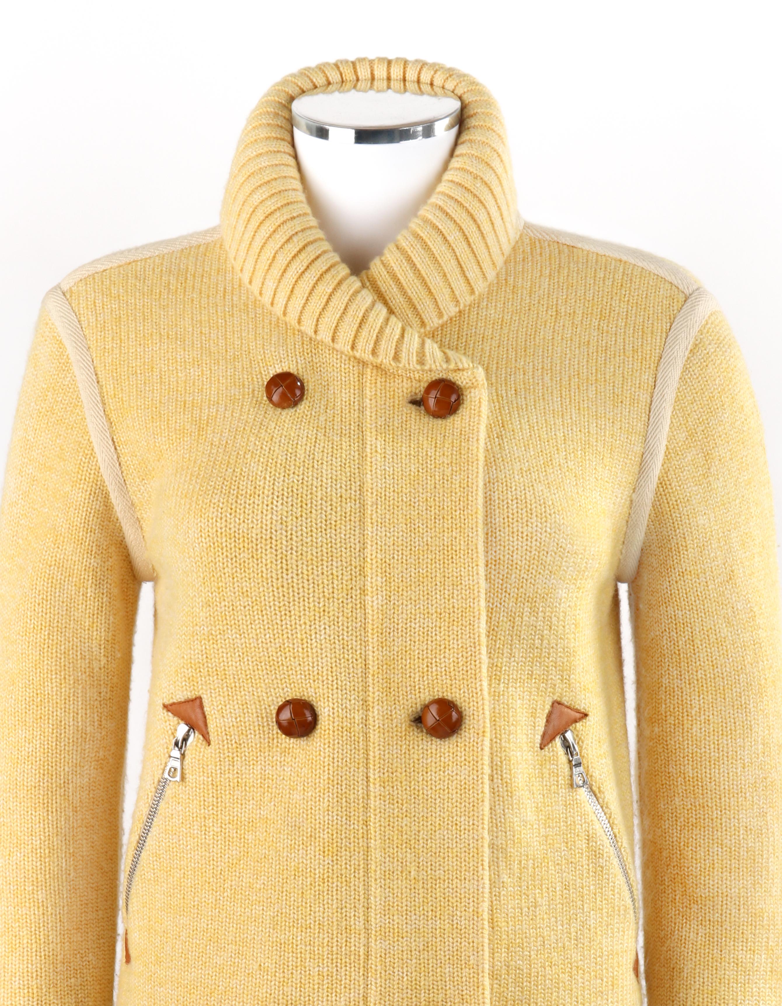 COURREGES c.1980’s Yellow Knit Double Breasted Leather Cardigan Sweater Jacket

Circa: 1980’s
Label(s): Courreges Paris 
Designer: Andre Courreges
Style: Double-breasted sweater jacket
Color(s): Shades of yellow, off white, tan, and brown
Lined:
