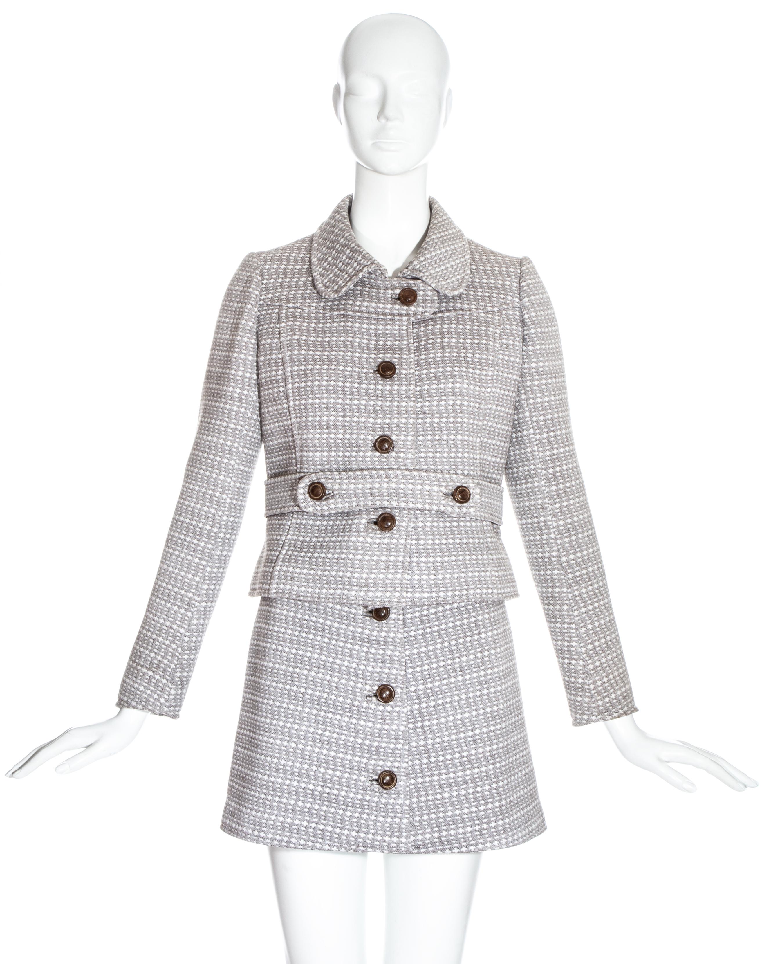 Courreges couture brown wool mini skirt suit with wooden buttons and silk lining. 

c. 1969