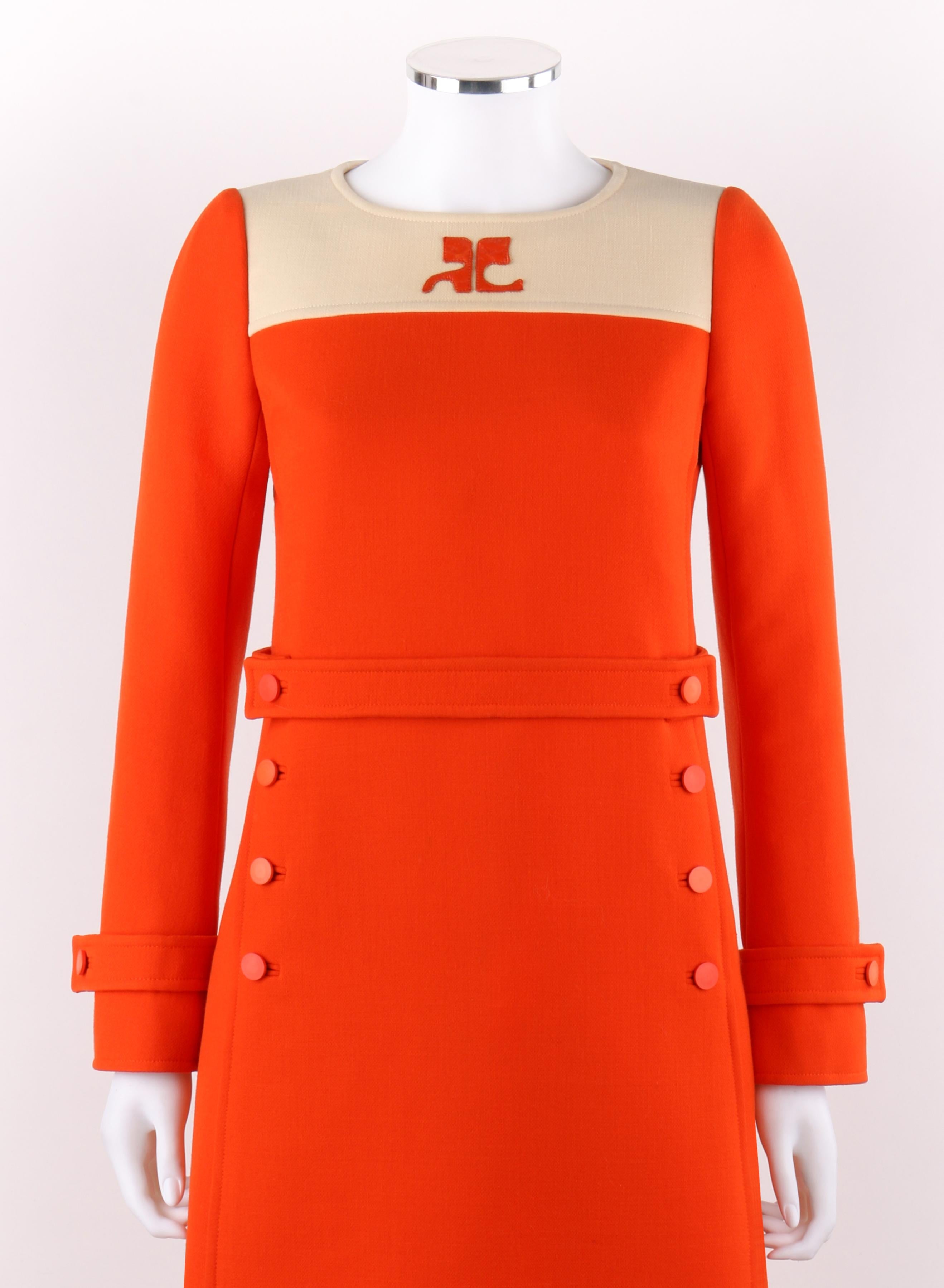 COURREGES Couture Future c.1960’s Orange Mod Signature Logo Wool Sheath Dress
 
Circa: 1970’s
Label(s): Courreges / Marie Leavell 
Product Line: Couture Future 
Couture: Yes / Numbered
Designer: Andre Courreges
Style: Sheath Dress
Color(s): Orange