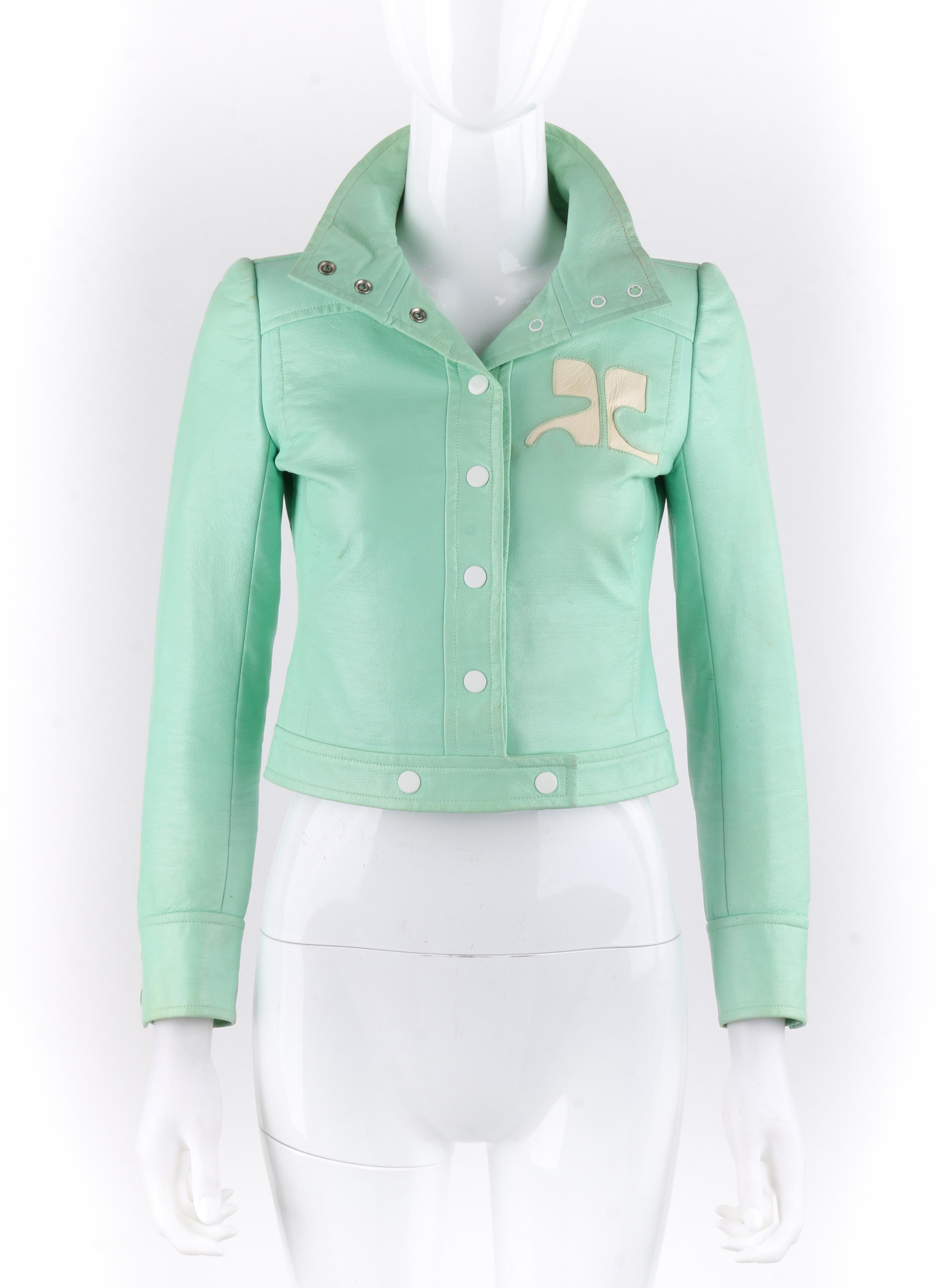 DESCRIPTION: COURREGES Couture Future c.1970's Mint Green Vinyl Signature Logo Cropped Jacket

Circa: c.1970’s
Label(s): Courreges Paris Couture Future; Made In France Exclusively For Bonwit Teller 
Designer: Andre Courreges
Style: Cropped