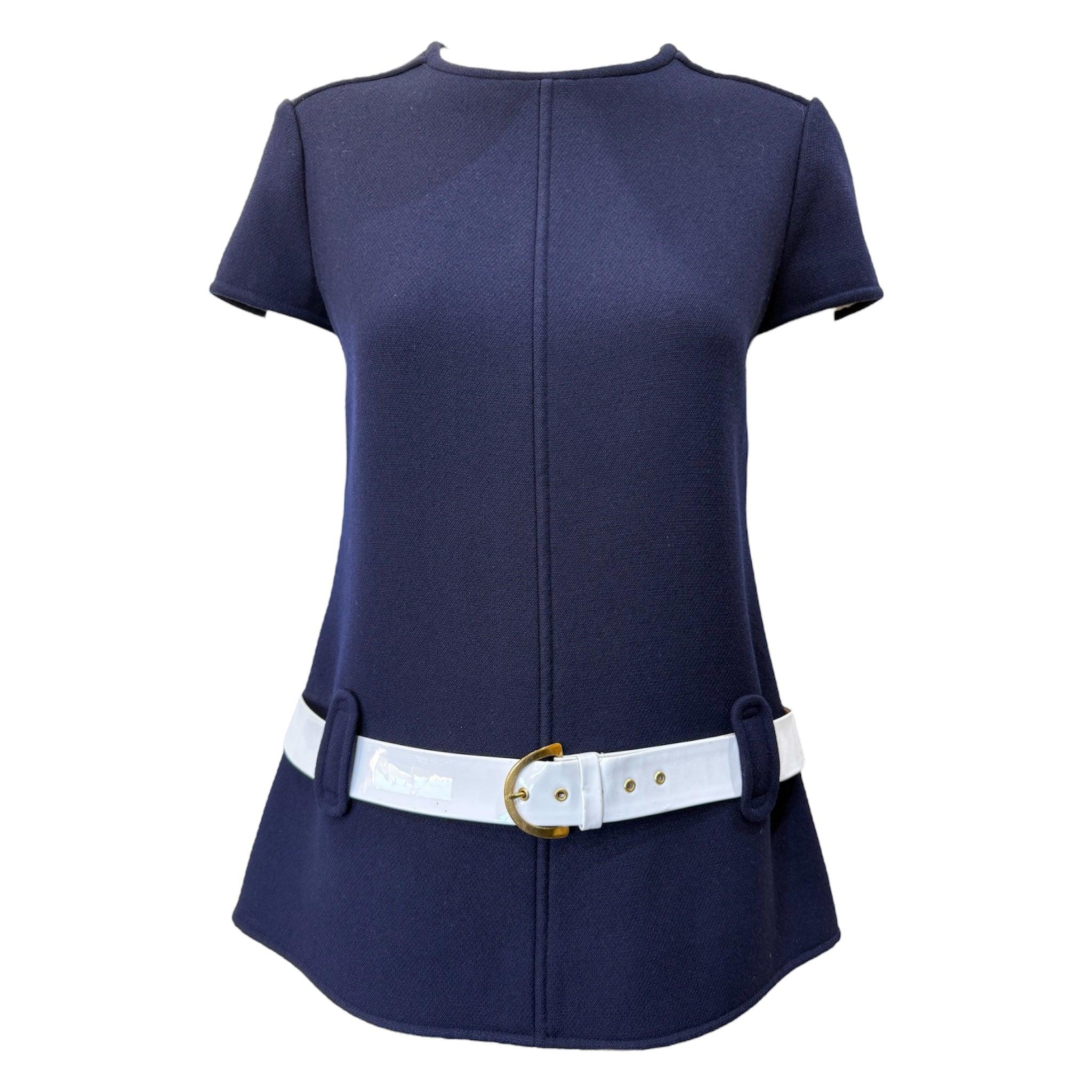 A rare time capsule piece by a designer who defined a generation. Courrèges 1960's ultra mod navy blue wool pantsuit with a patent white belt. Courrèges was a pioneer of women's pantsuits, and his mod agenda helped push women's trousers into the