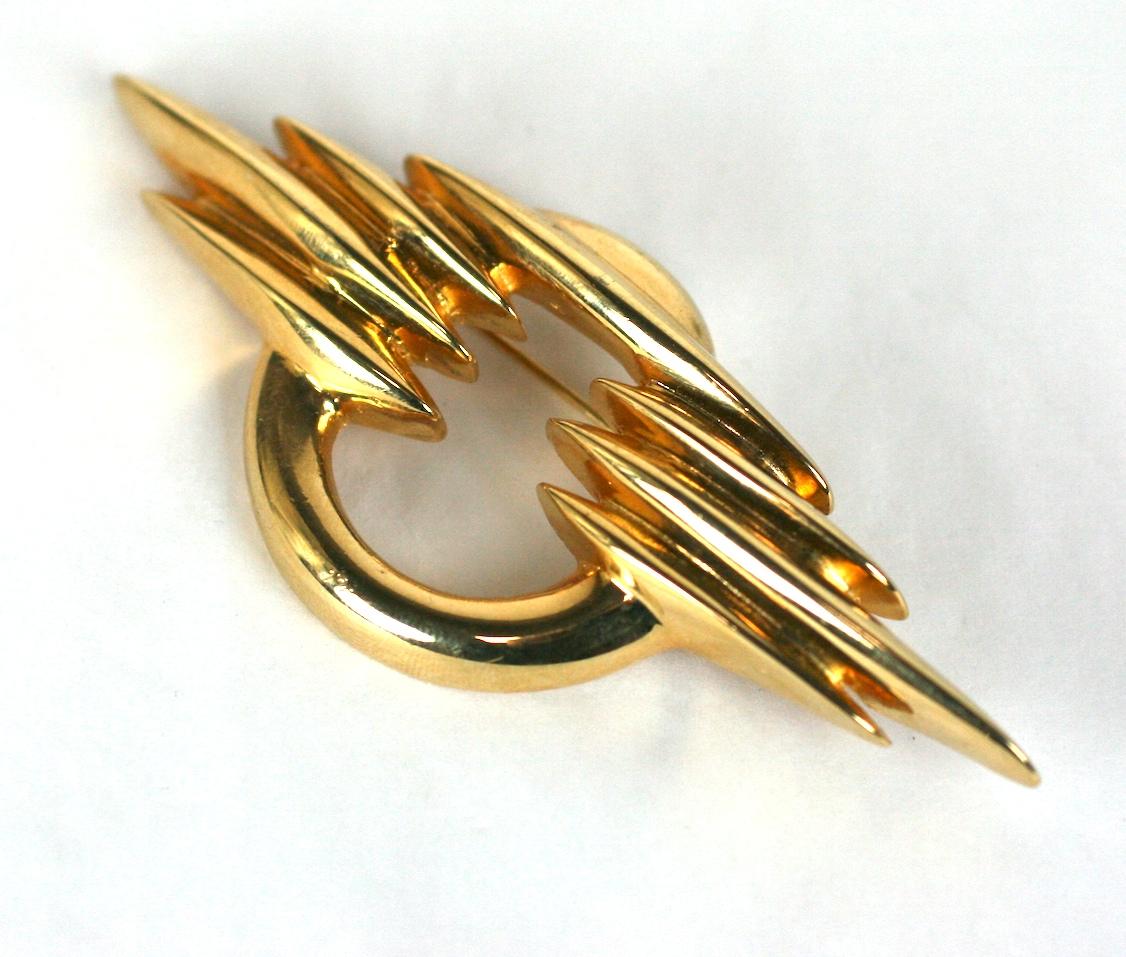 Courreges Modernist Brooch from the 1980's. Gilt metal made to look like an abstracted planet and clouds with a signature modernist bent. 1980's France.
3.5
