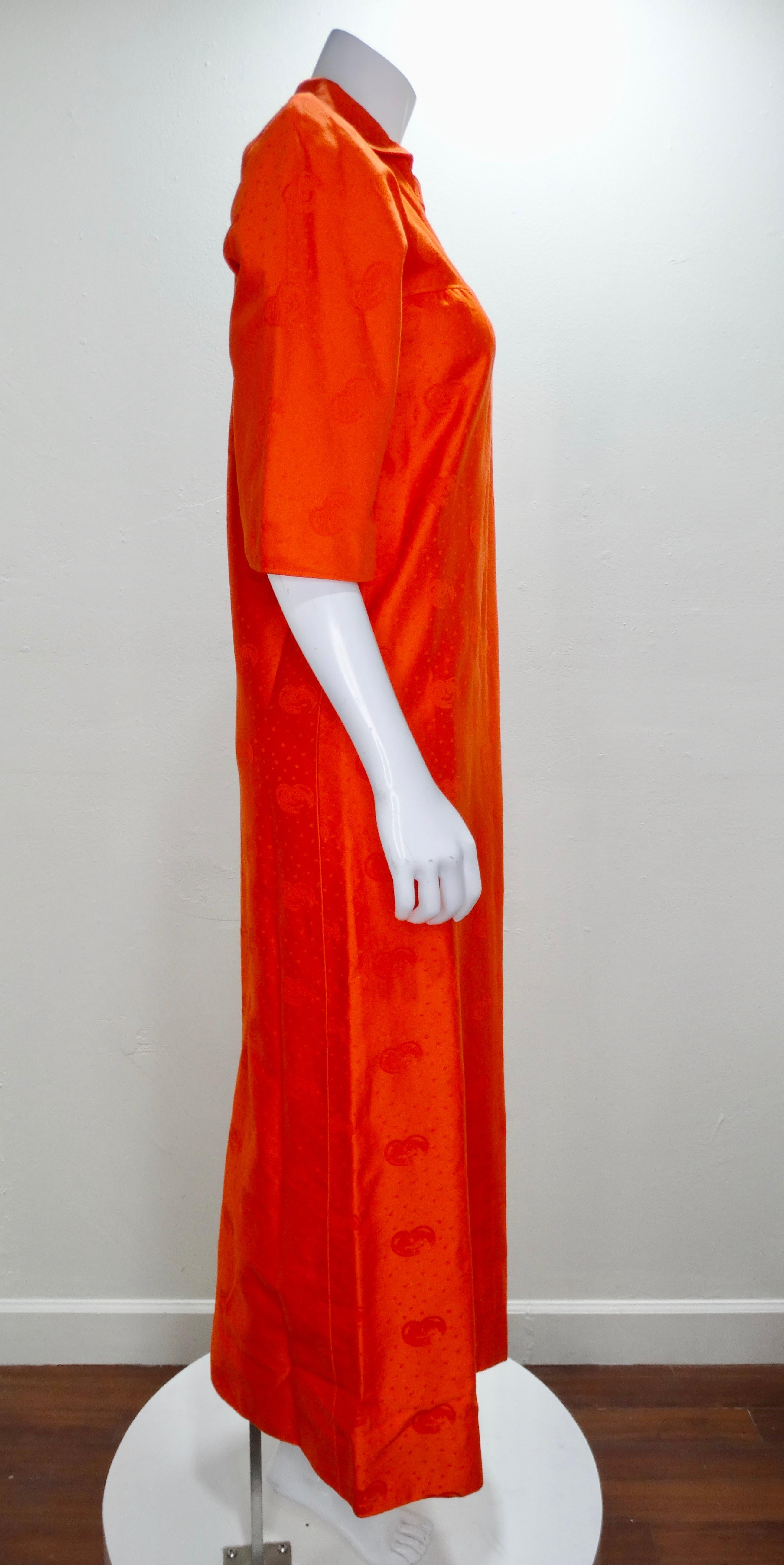 The most stunning kaftan by no other than the French label Courreges! Circa 1970s, this beautiful orange kaftan is crafted from 100% cotton and features an abstract print, a front zipper closure with a detailed v-neck and quarter bell sleeves. A
