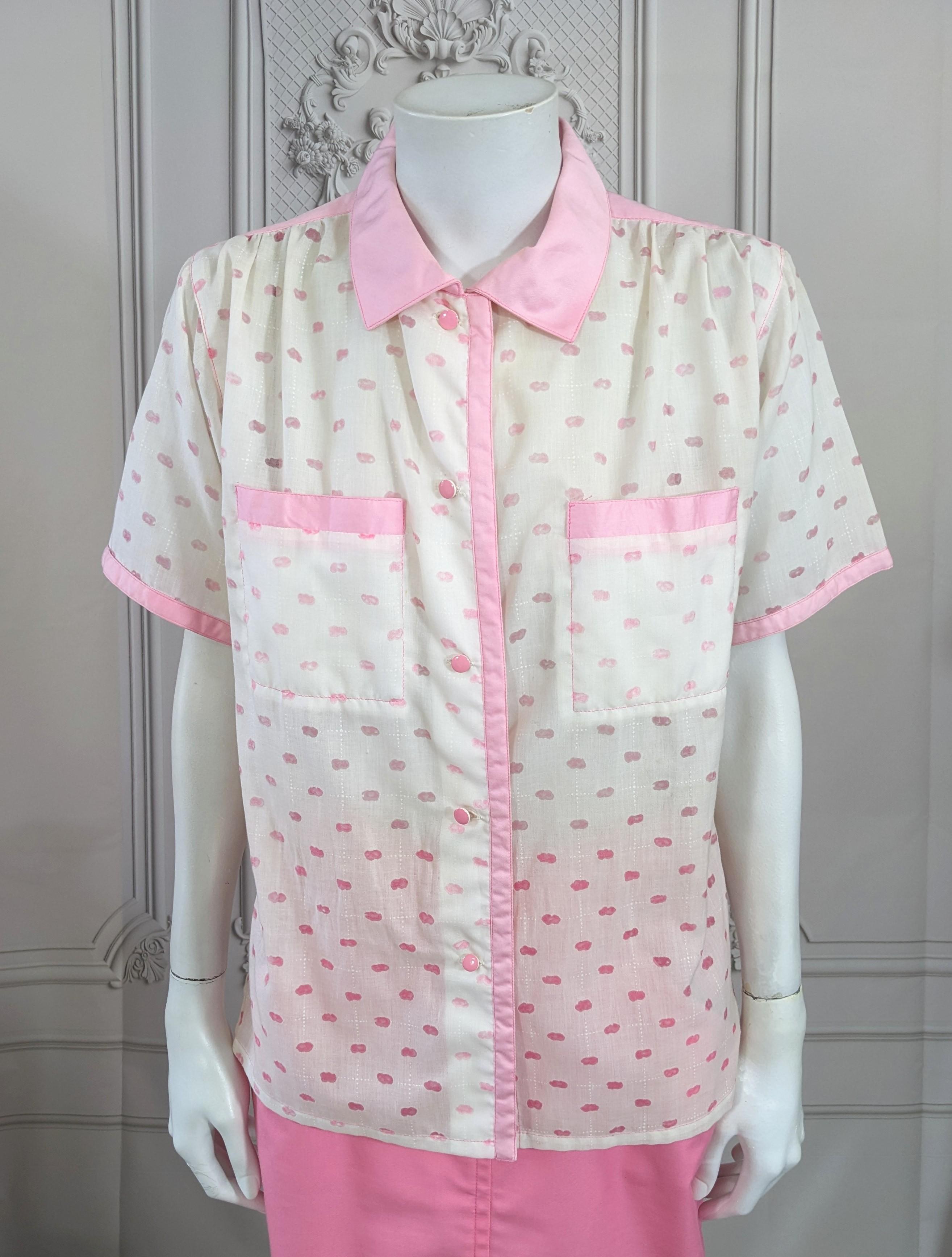 Courreges Pink Cloud Blouse from the 1980's with amazing voided textile. The pink cloud motifs are sheer on the white ground and the blouse is trimmed in pink cotton sateen. Small size. 1980's France. Courreges size 000. 