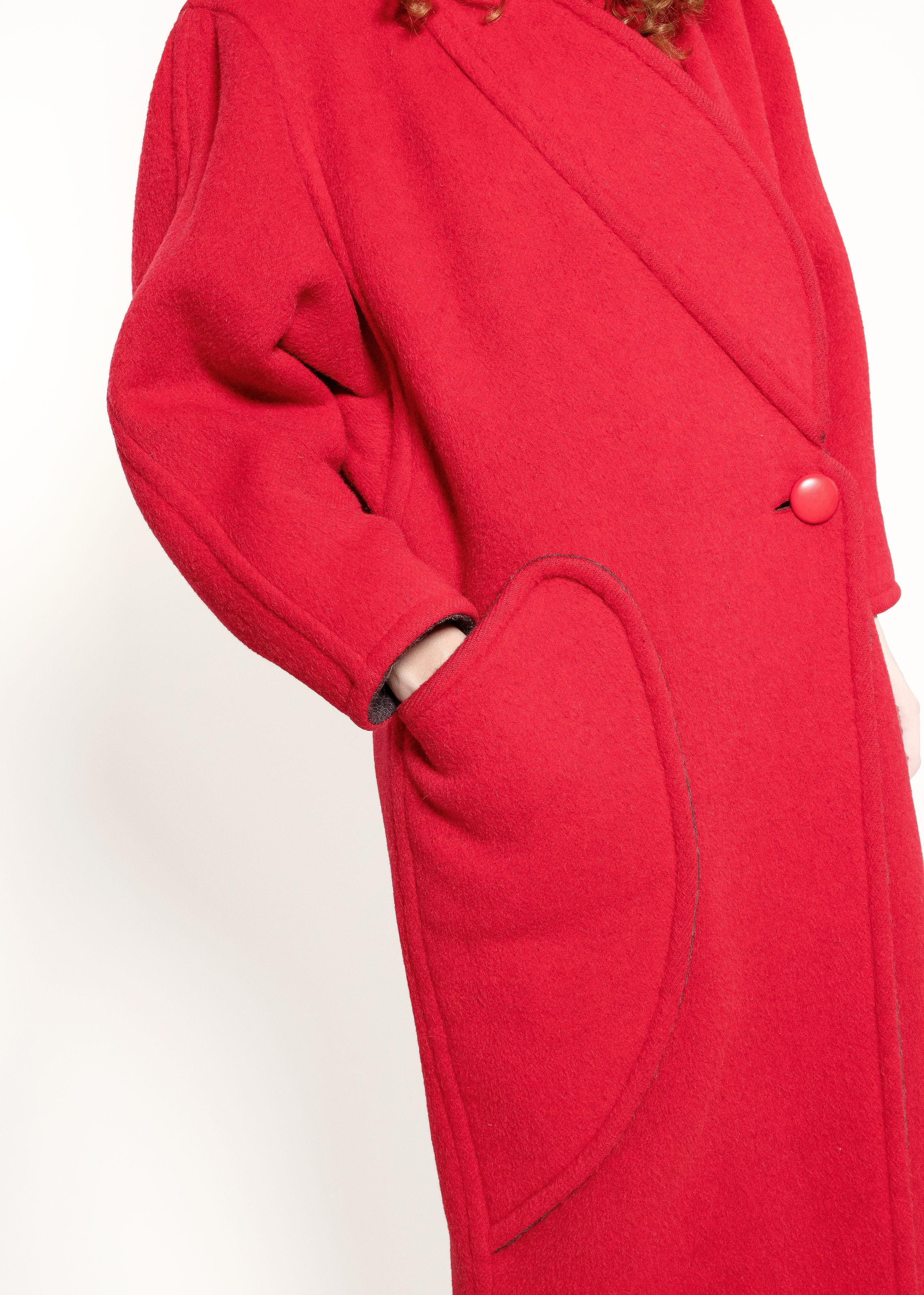 This Courreges Red Wool Coat combines the luxurious warmth of natural wool with the unique texture of lama and alpaca, making it perfect for those cold winter days!

Made from 30% lama, 20% alpaca, 20% wool, 20% mohair and 10% guanaco. It has one