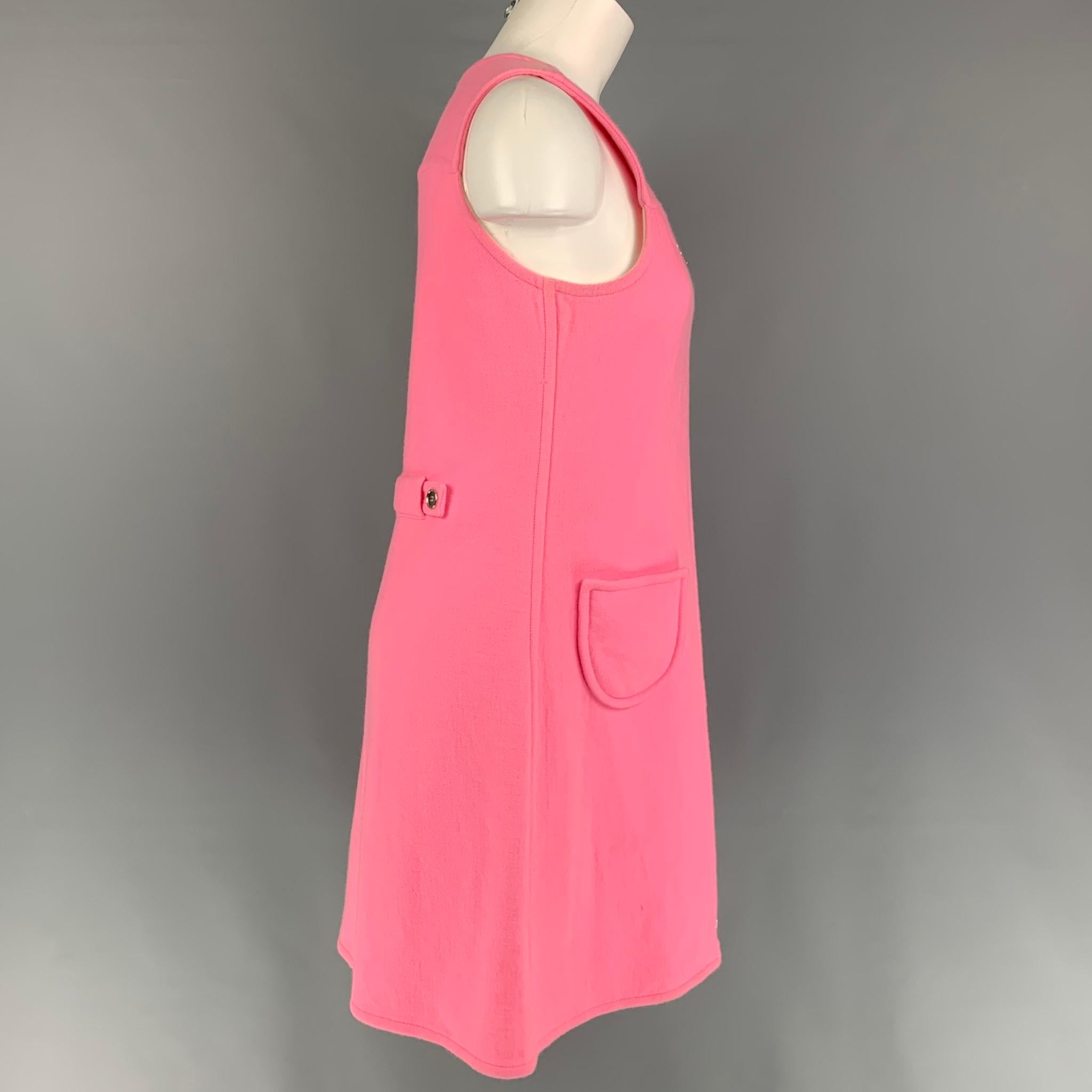 COURREGES dress comes in a pink wool / angora featuring a shift style, sleeveless, back strap detail, front pockets, and a front zip up closure. Made in France.

Very Good Pre-Owned Condition.
Marked: Size tag removed. 
Original Retail Price: