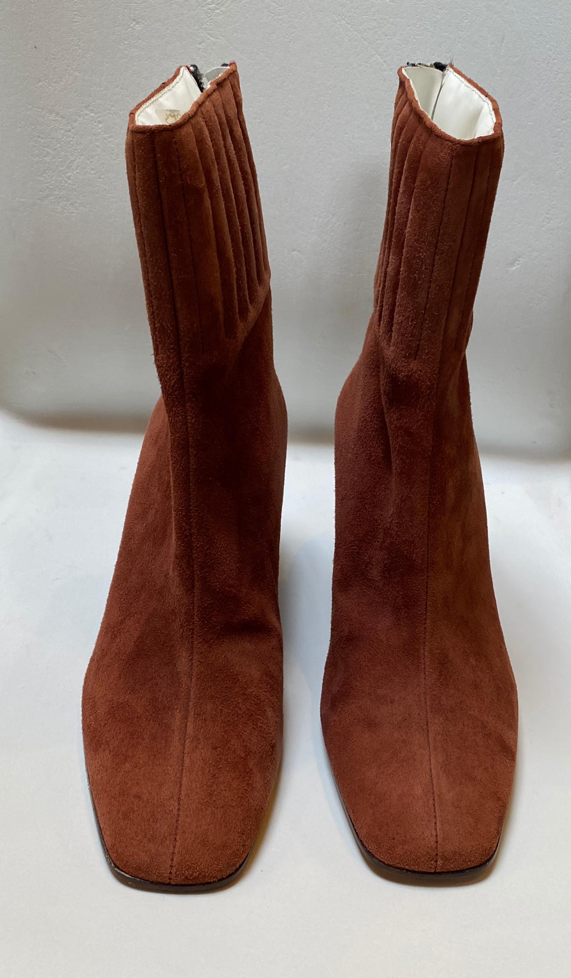 Vintage Courreges prune-colored suede ankle boot with back zipper and clear plexi wedge heel.