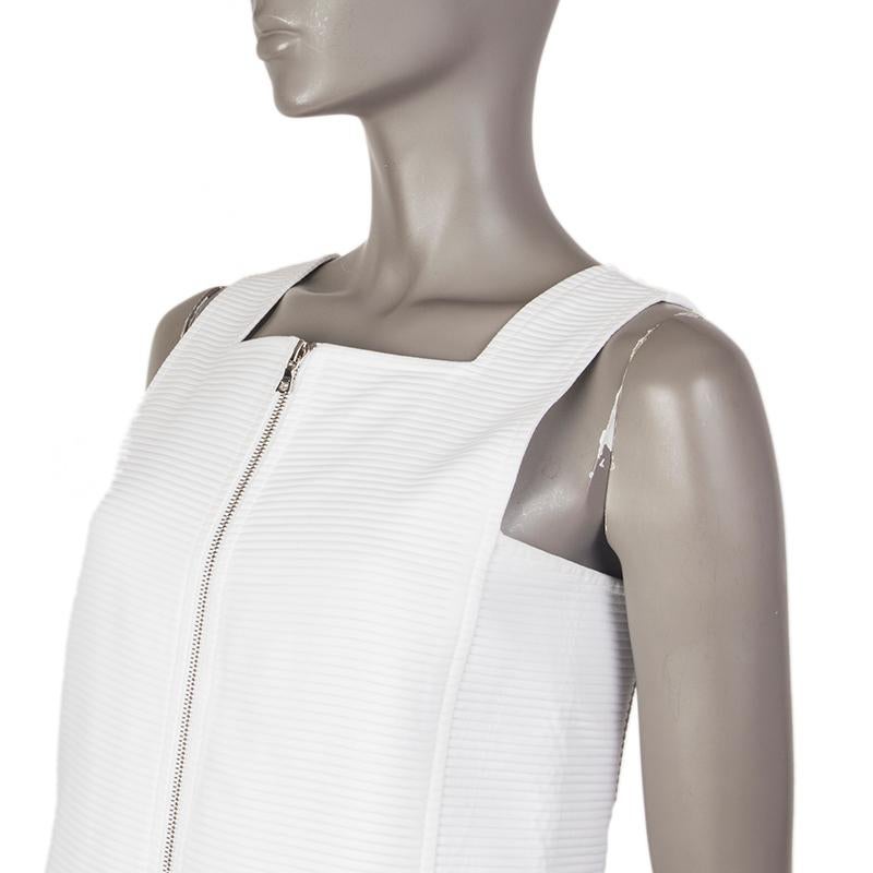 100% authentic Courreges rib-quilted a-line dress in white cotton (100%). With square neck- CLoses with two-way pewter zippers along the front and back. Lined in white cotton (100%). Has been worn and is in excellent condition. 

Measurements
Tag