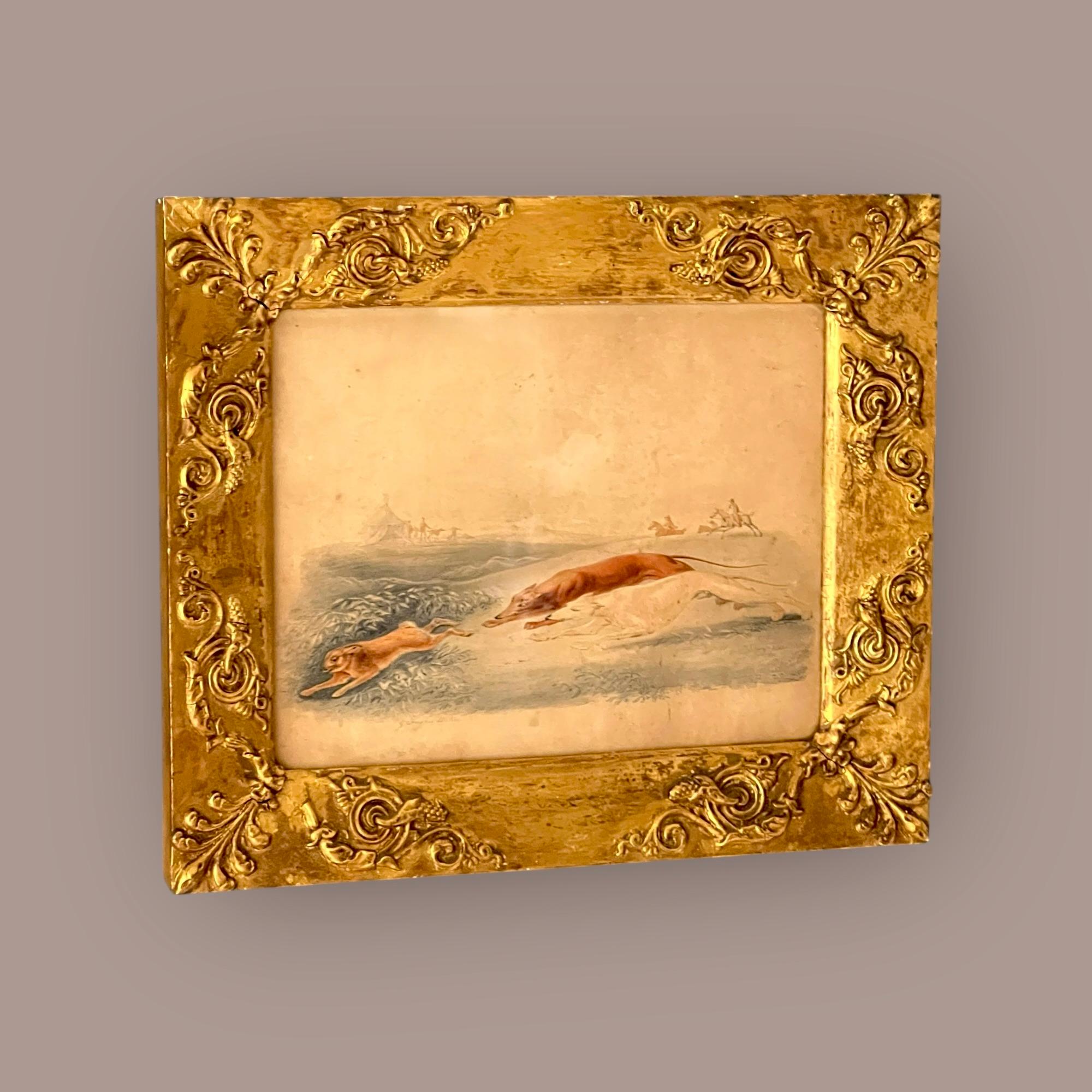 A Charming 19th-Century Watercolour of Coursing Greyhounds or Lurchers
Framed, glazed, and signed in pencil.

This beautifully executed sporting watercolour captures a dynamic scene of two sighthounds in full chase of a hare, with riders on