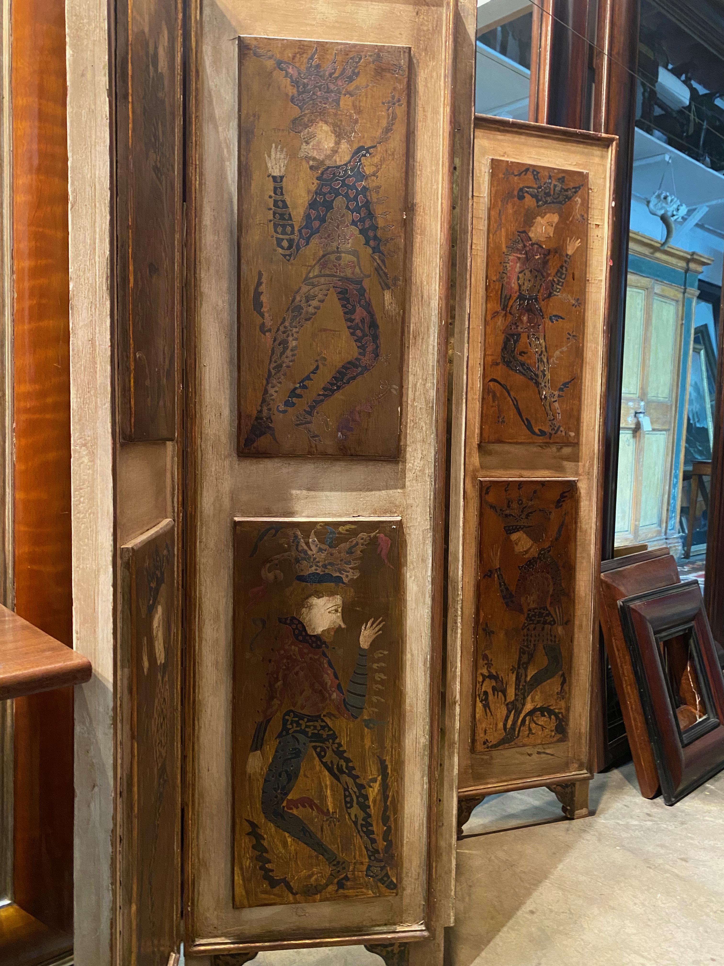 This Italian wooden folding screen from the 19th century is a true marvel of craftsmanship and artistry. Standing at 63