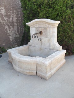 Coustelet French Carved Limestone Wall Fountain with Arched Top and Basin