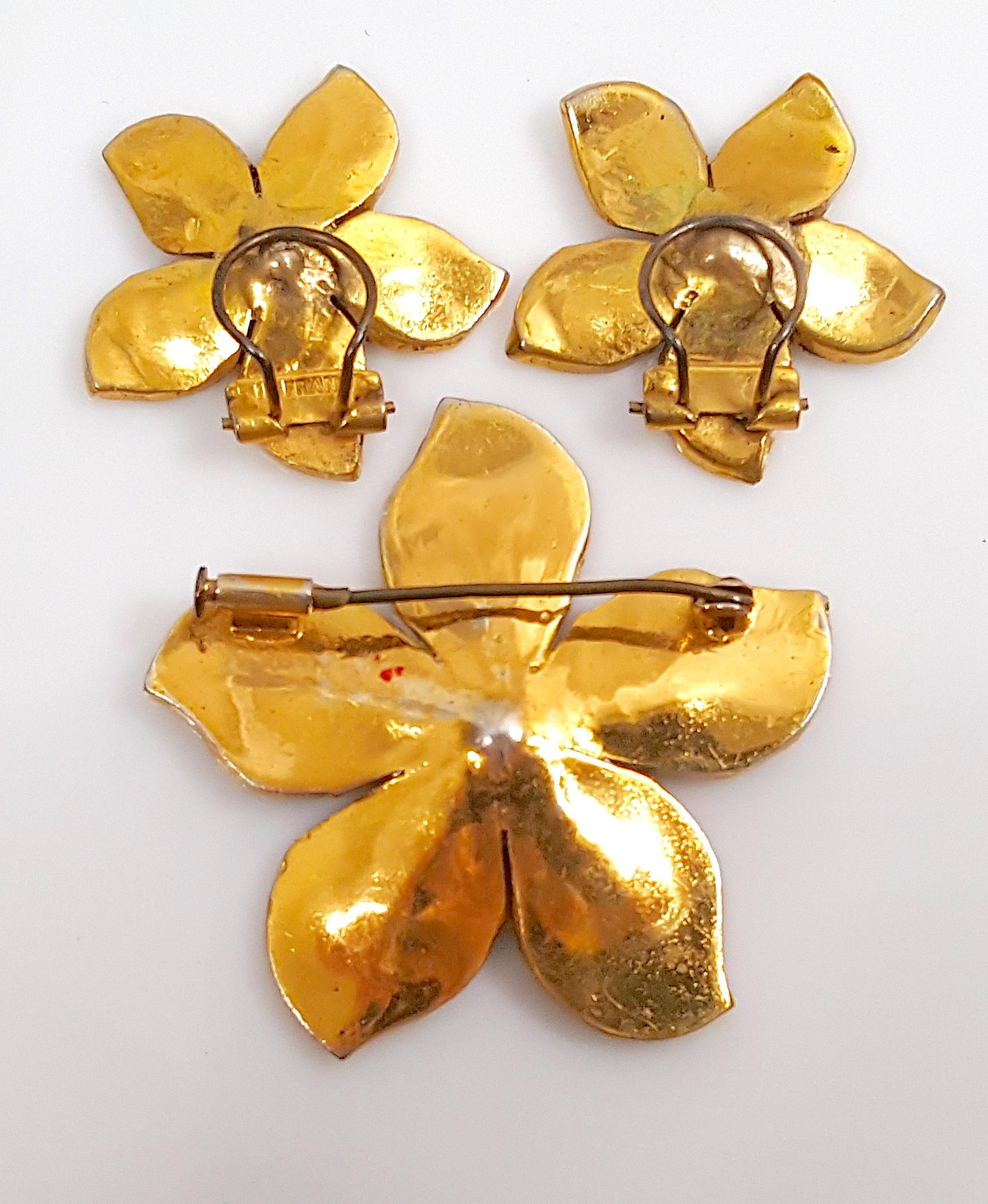 This rare signed couture set of pave-crystal and gold-plated brooch and earrings from the Art Deco period is marked in the manner of one-off costume jewelry commissioned by Gabriel 