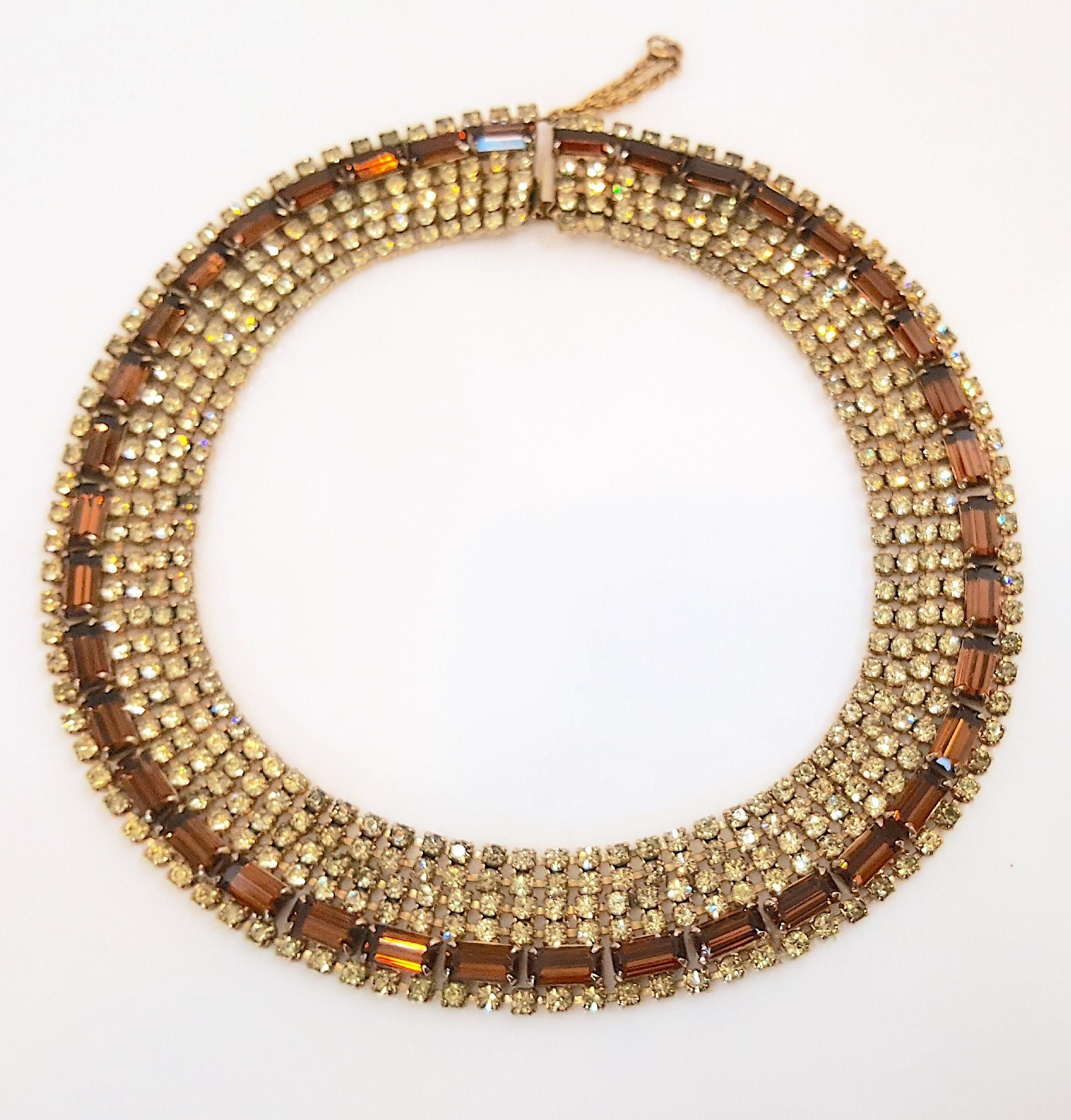While making similar mid-century haute-couture costume-jewelry necklaces for Christian Dior, designer Max Muller who was based near Kaufbeuren, Western Germany, created this unsigned gold-tone choker collar featuring faux-diamond mixed-cut brown and